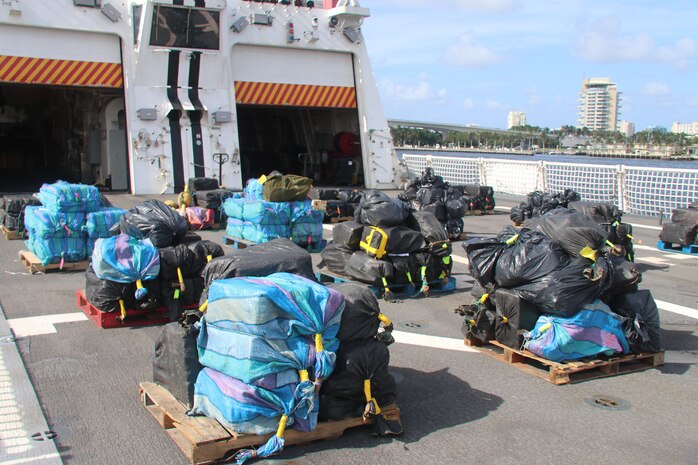 An estimated 12,500 pounds of cocaine and 50 pounds of marijuana lie on pallets onboard the Coast Guard Cutter Hamilton Aug. 1, 2018, in Port Everglades