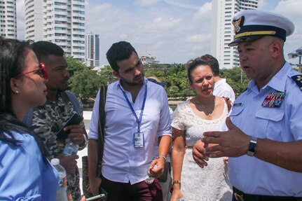 Chief Warrant Officer Miguel Felix explains the Coast Guard Cutter Hamilton's capabilities to members of the Colombian media July 25, 2018, during Sail Cartagena de Indias 2018 in Cartagena, Colombia.