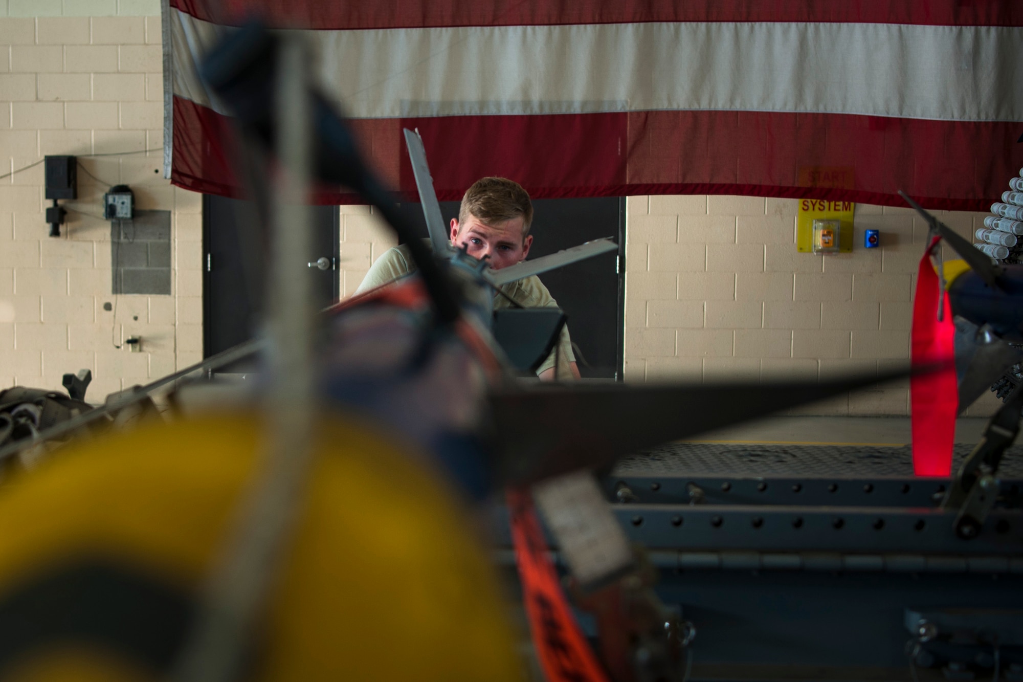Senior Airman Robert Monk, 23d Aircraft Maintenance Squadron weapons load crew member, inspects an AIM-9 Sidewinder missile during a Monthly Proficiency Required Load (MPRL), Aug. 7, 2018, at Moody Air Force Base, Ga. The weapons standardization section ensures weapons load crews are combat ready through evaluations consisting of MPRLs, semi-annual evaluations and flightline inspections. (U.S. Air Force photo by Airman Taryn Butler)