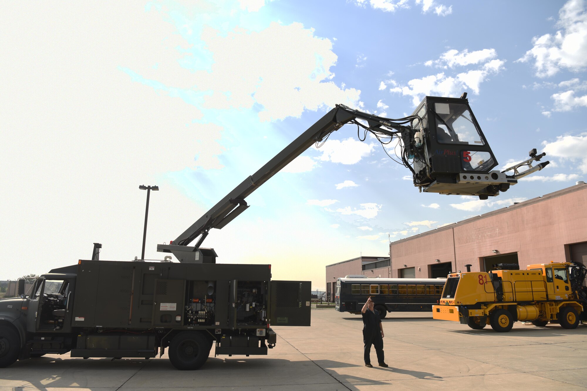 Senior Airman Rebecca English, a 28th Logistics Readiness Squadron vehicle maintenance technician, ensures a deicing machine is operating correctly at Ellsworth Air Force Base, S.D., Aug. 9, 2018. Members of the 28th LRS vehicle maintenance shop must ensure all of Ellsworth AFB’s snow fleet vehicles operate a peak efficiency so they can clear the flight line and roads during adverse weather conditions. (U.S. Air Force photo by Airman 1st Class Thomas Karol)