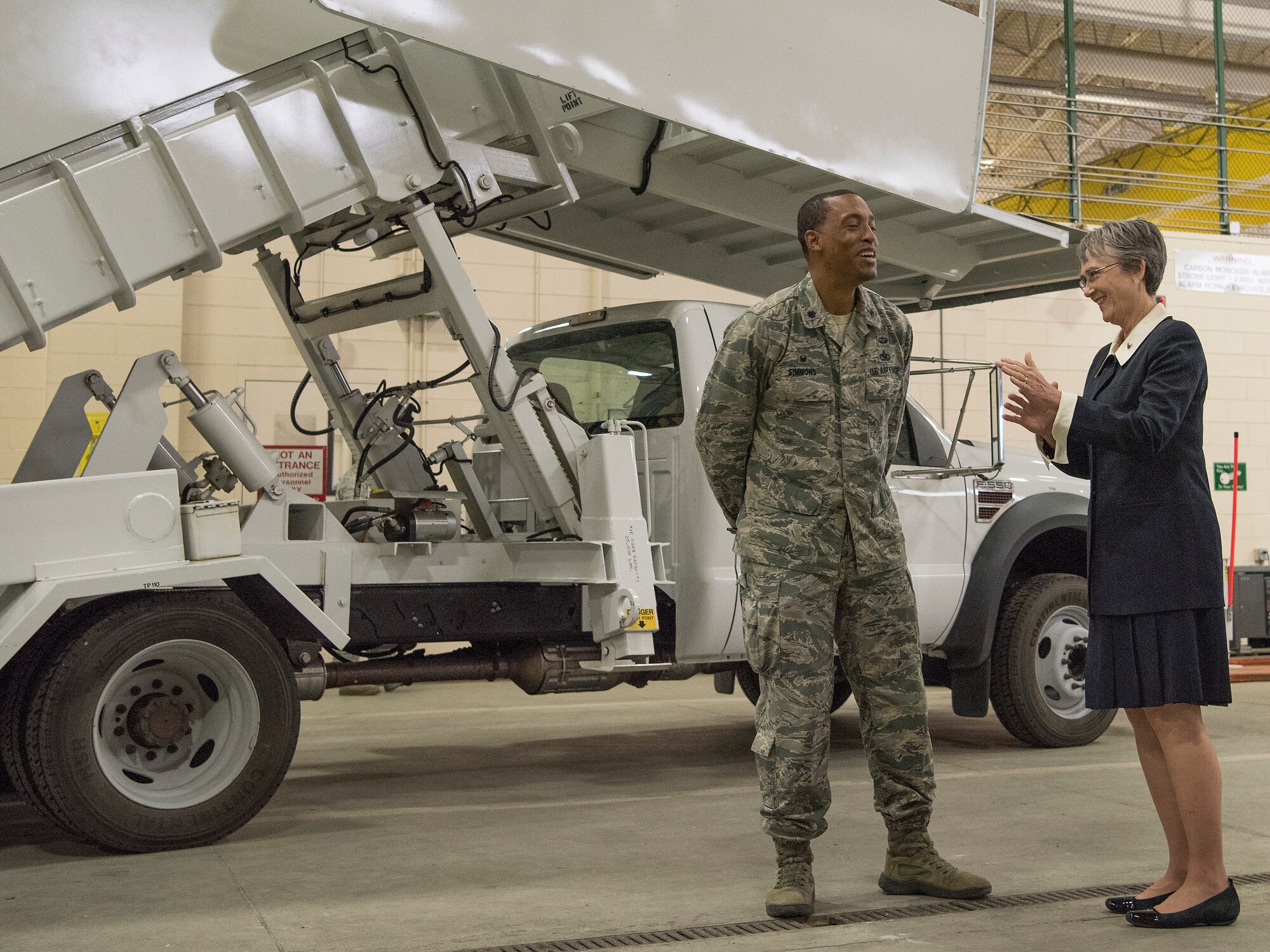Secretary of the Air Force Heather Wilson talks with Lt. Col. Christopher Simmons, Commander of the 732nd Air Mobility Squadron during a visit at the Joint Mobility Complex at Joint Base Elmendorf-Richardson, Alaska, Aug. 9, 2018. During her visit Wilson met with JBER Airmen and personally saw the unique capabilities they bring to the Pacific theater.
