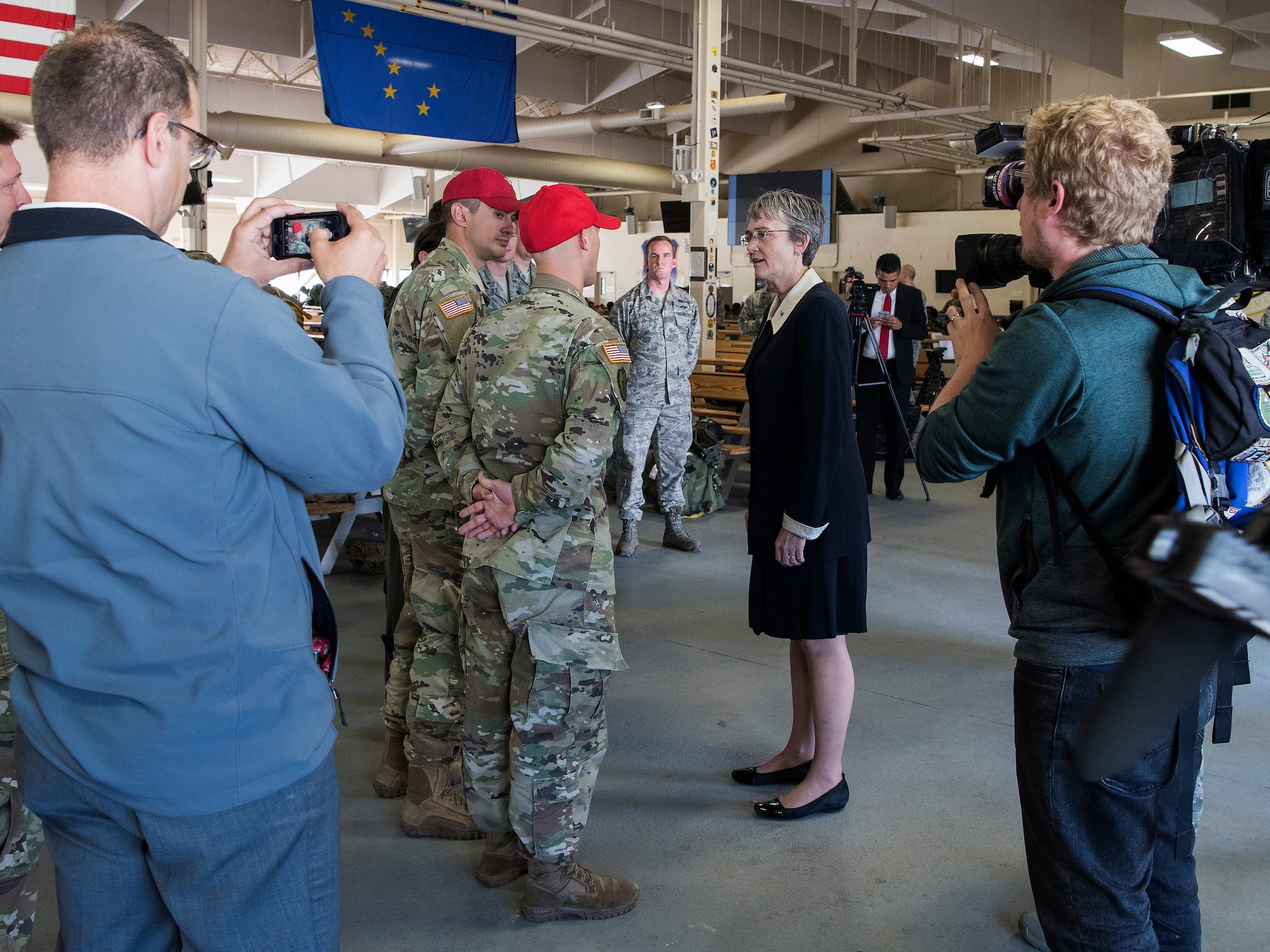 Secretary of the Air Force Heather Wilson speaks with Soldiers and Airmen during a visit at the Joint Mobility Complex at Joint Base Elmendorf-Richardson, Alaska, Aug. 9, 2018. During her visit Wilson met with JBER Airmen as well as Soldiers and personally saw the unique capabilities they bring to the Pacific theater.