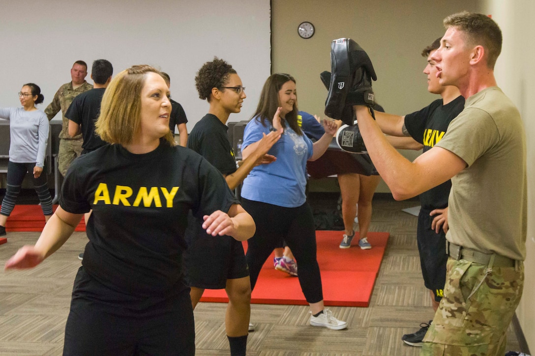 Soldiers practice self-defense techniques during a sexual assault prevention program.