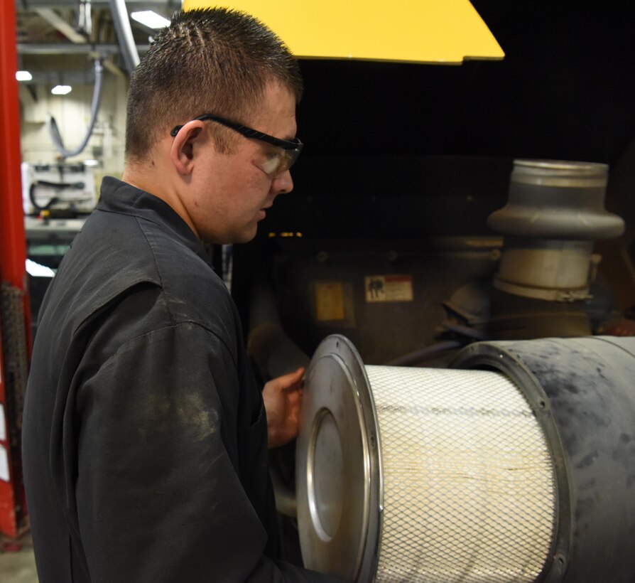 Senior Airman Alexander Lubbe, a 28th Logistics Readiness Squadron vehicle maintenance technician, changes an air filter on a snow removal vehicle at Ellsworth Air Force Base, S.D., Aug. 9, 2018. Members of the 28th LRS vehicle maintenance shop perform a rebuild during the summer months on all the base’s snow fleet vehicles to ensure they are ready to operate effectively when winter arrives. (U.S. Air Force photo by Airman 1st Class Thomas Karol)