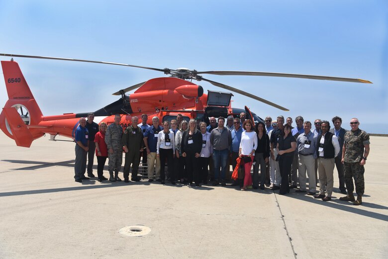 U.S. Coast Guard search and rescue members, and U.S. Northern Command and North American Aerospace Defense Command civic leaders and commanders stand for a group photo on Aug. 7, 2018 at Vandenberg Air Force Base, Calif. (U.S. Air Force photo by Airman 1st Class Aubree Milks/Released)
