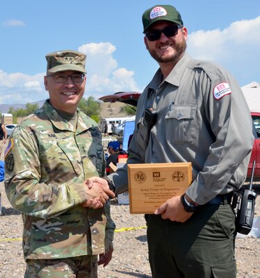 Maj. Gen. Keith Nava, National Guard adjutant and commander, thanks USACE park ranger Wesley Myers for the Corps’ participation in the National Guard's 4th Annual Card-board Regatta held July 27, 2018, at Cochiti Lake.