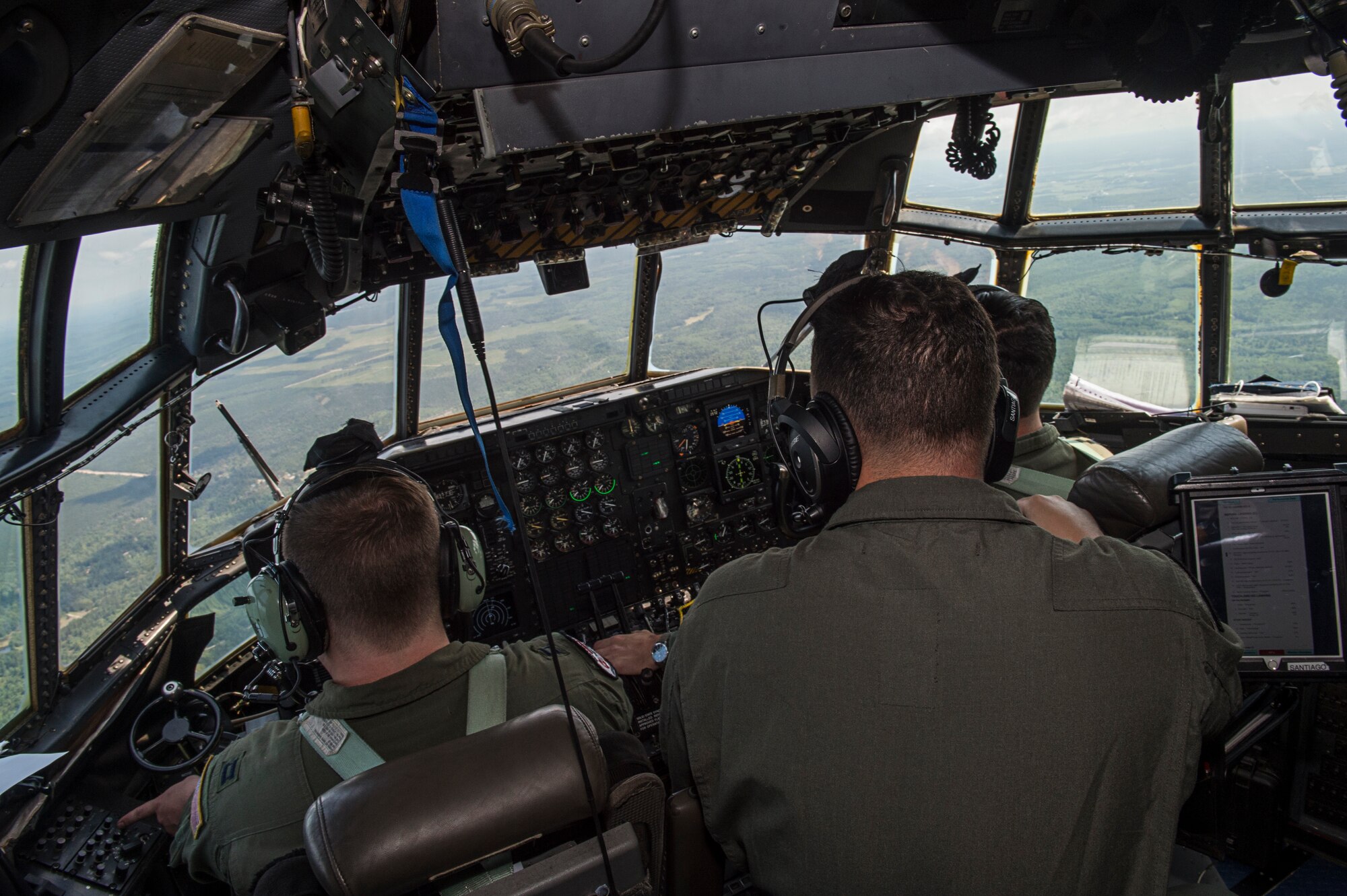 A C-130H Hercules air crew assigned to the Air National Guard’s 165th Airlift Wing from Savannah, Georgia., flies en-route to Alpena Combat Readiness Training Center in Michigan during exercise Northern Strike, Aug. 8. The 165th AW provided the only C-130 aircraft used to transport heavy cargo during the exercise. Northern Strike is a robust military readiness exercise coordinated by the Michigan Army National Guard which features joint and multi-national militaries working together for total force integration. (U.S. Air Force photo by Tech. Sgt. Liliana Moreno)