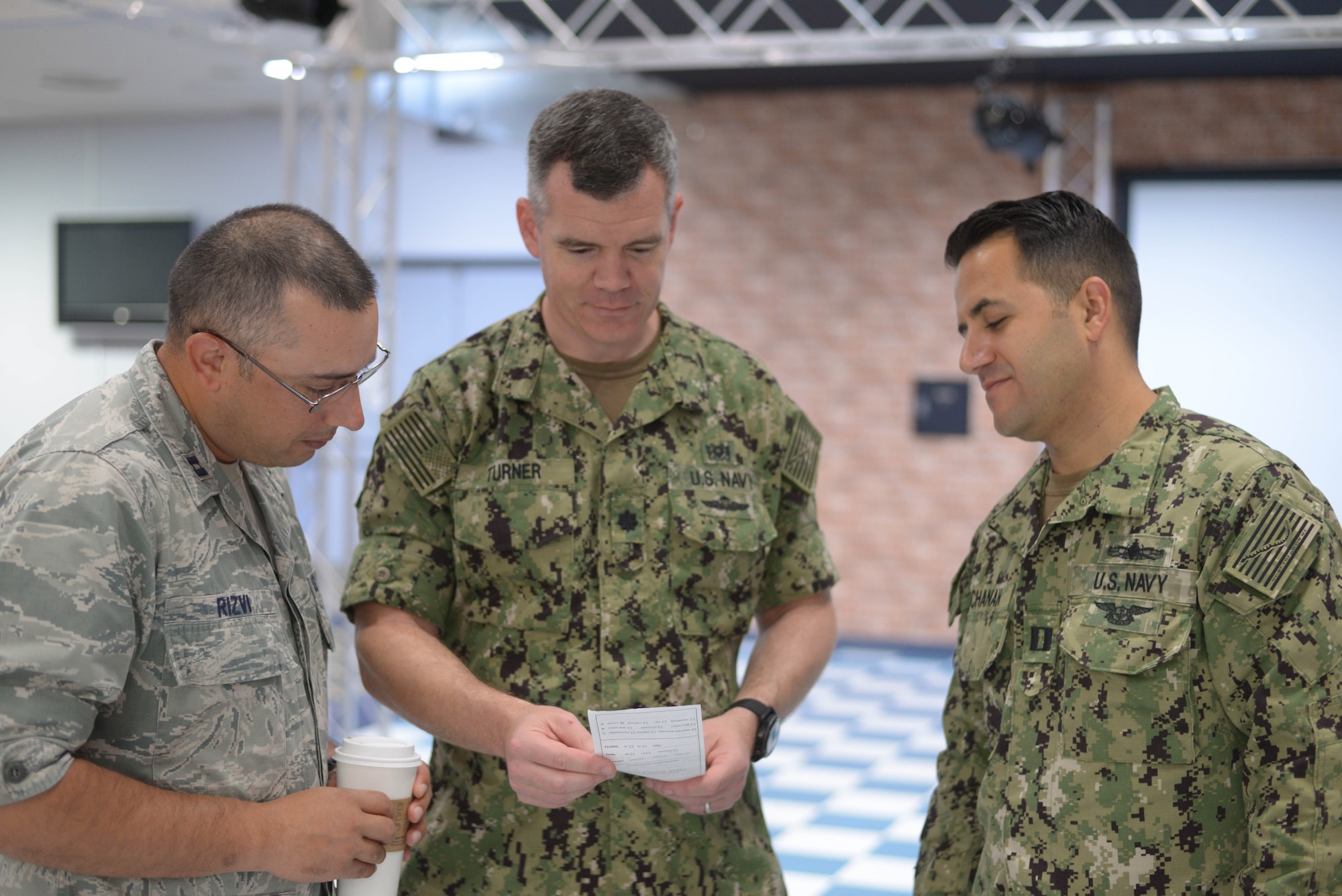 Medical personnel from Yokosuka Naval Base, Japan, and Yokota Air Base, Japan worked together during the tabletop exercise portion of the Medical Management of Chemical and Biological Casualties (MCBC) Short Course held at Yokota Air Base, Japan, August 8, 2018.