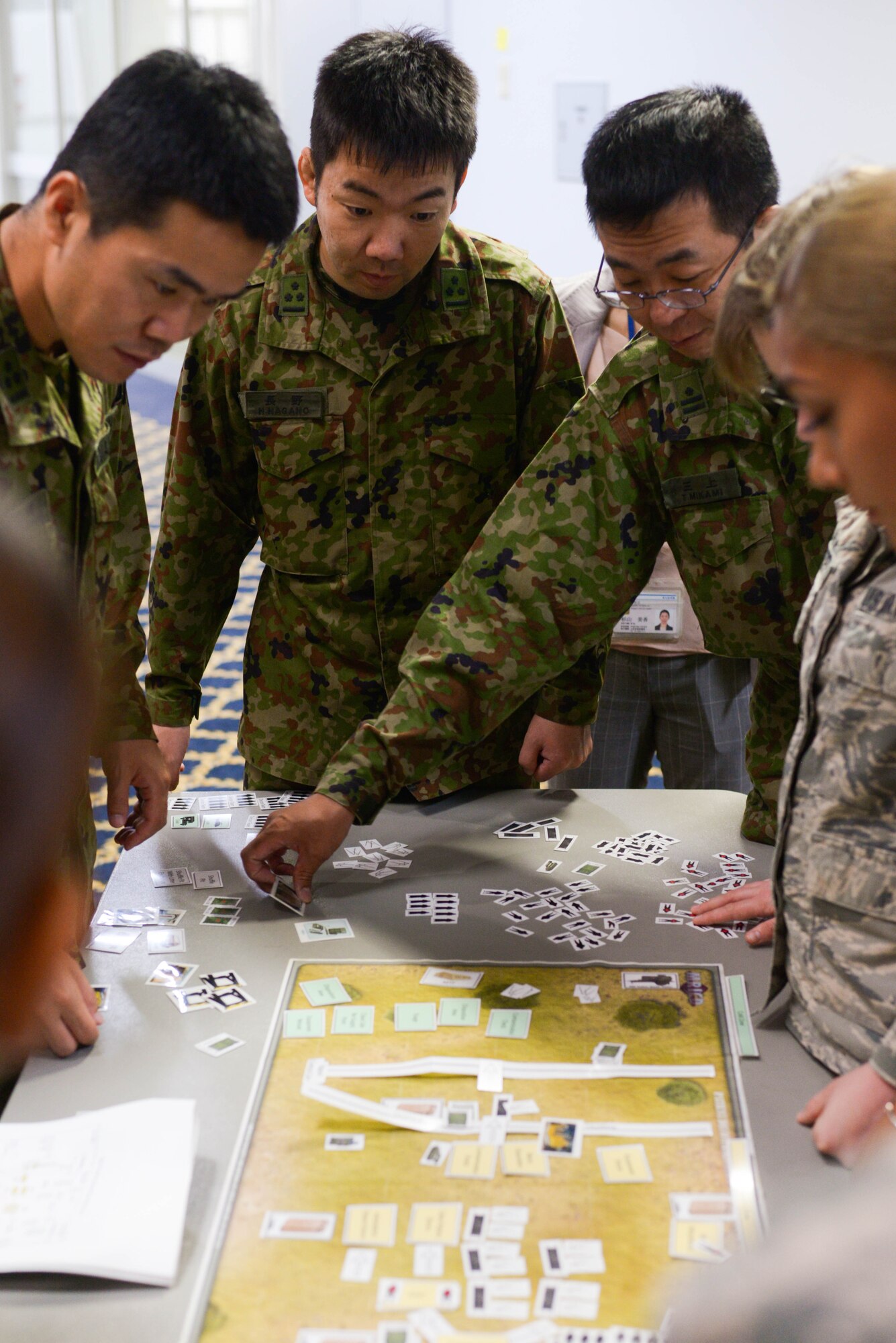 Japanese Ground Defense Forces demonstrate their plans to set up a decontamination area during a tabletop simulation at Yokota Air Base, Japan, August 8, 2018.