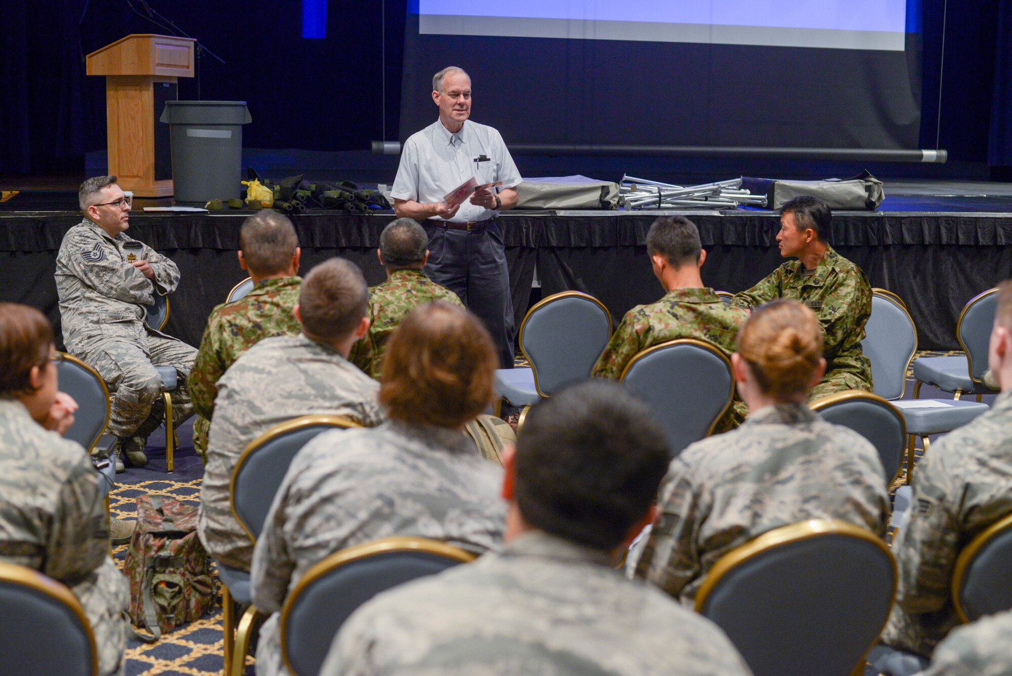 Retired Army Col. Scott Stanek, MCBC Instructor, delivers classroom instruction to United States Airmen and Japanese Ground Defense Forces at Yokota Air Base, Japan, August 8, 2018.