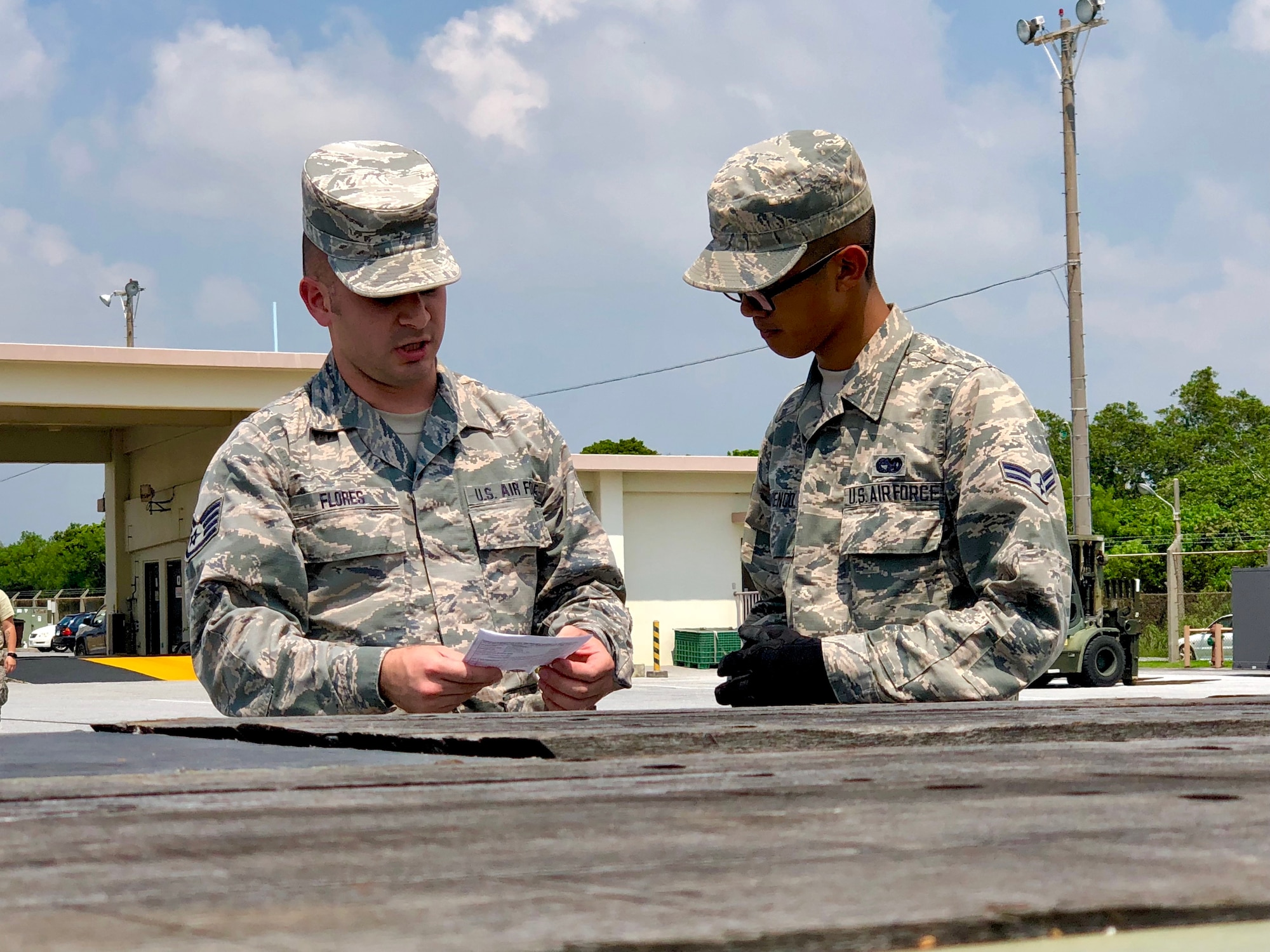On Aug 9,  (on left) Staff Sgt. Eduardo Flores, 927th Vehicle Operations Flight, operator provides instruction in the safe operation of semi tractor and trailers to Airman 1stClass Jeremy Yuvienco, 18th LRS Vehicle Operations Flight, operator.

 

Citizen Airmen from the 927th Logistics Readiness Squadron, MacDill Air Force Base, Florida, traveled to Kadena Air Base, Japan to perform their two-week annual training and work alongside their active duty counterparts from the 18th LRS. (U.S. Air Force photo by Tech. Sgt. Peter Dean)