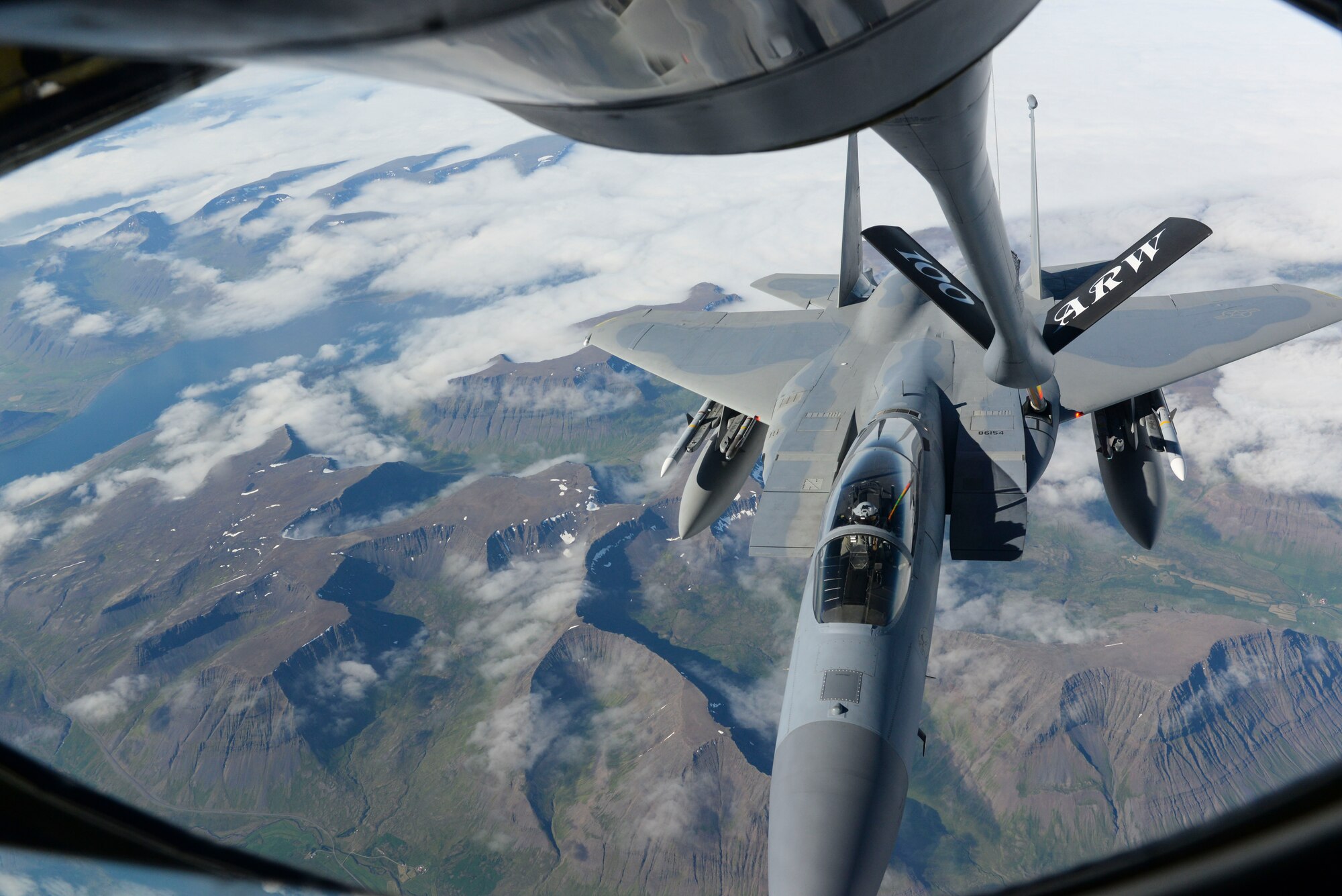 A U.S. Air Force F-15C Eagle assigned to the 493rd Expeditionary Fighter Squadron receives fuel from a KC-135 Stratotanker assigned to the 351st Air Refueling Squadron over Iceland, Aug. 10, 2018. The 100th Air Refueling Wing supported deployed Airmen and aircraft from the 48th Fighter Wing in support of NATO’s Icelandic Air Surveillance mission.  The U.S. has conducted the NATO mission in Iceland annually since 2008. (U.S. Air Force photo by Airman 1st Class Alexandria Lee)