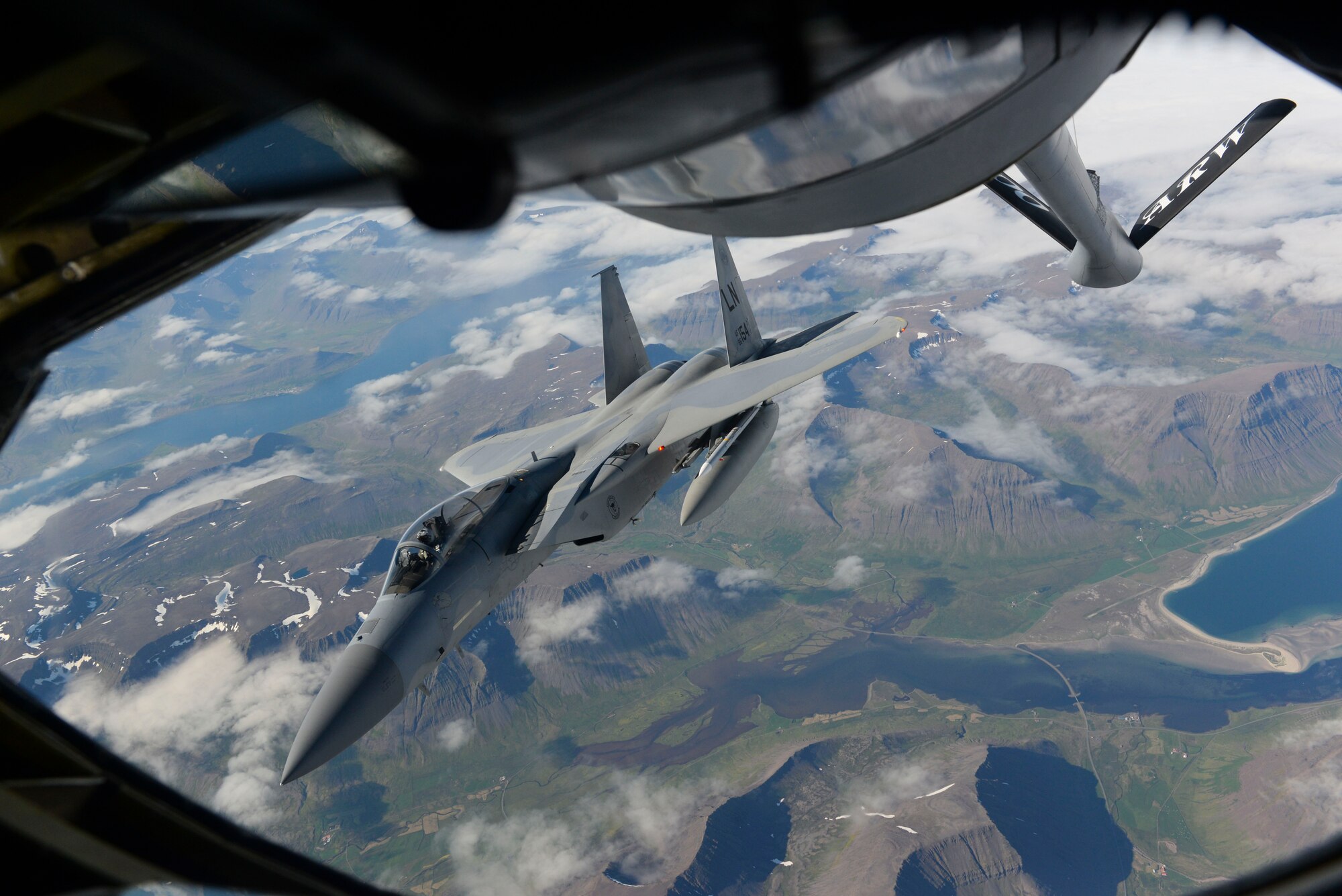 A U.S. Air Force F-15C Eagle assigned to the 493rd Expeditionary Fighter Squadron flies near a KC-135 Stratotanker assigned to the 351st Air Refueling Squadron over Iceland, Aug. 10, 2018. Airmen from the 48th Fighter Wing, RAF Lakenheath, England, deployed to Keflavik Air Base, Iceland, to conduct an air surveillance mission in support of NATO alliance commitments. (U.S. Air Force photo by Airman 1st Class Alexandria Lee)