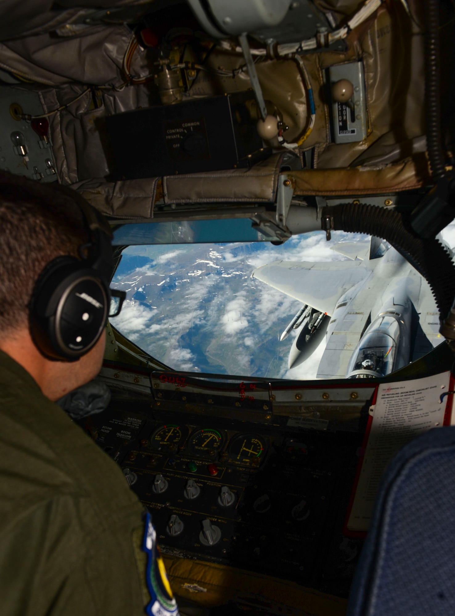 U.S. Air Force Staff Sgt. Juan Upegui, 351st Air Refueling Squadron boom operator, fuels a U.S. Air Force F-15C Eagle assigned to the 493rd Expeditionary Fighter Squadron over Iceland, Aug. 10, 2018. The U.S. routinely and visibly demonstrates commitment to its allies and partners through the global employment of its military forces. (U.S. Air Force photo by Airman 1st Class Alexandria Lee)