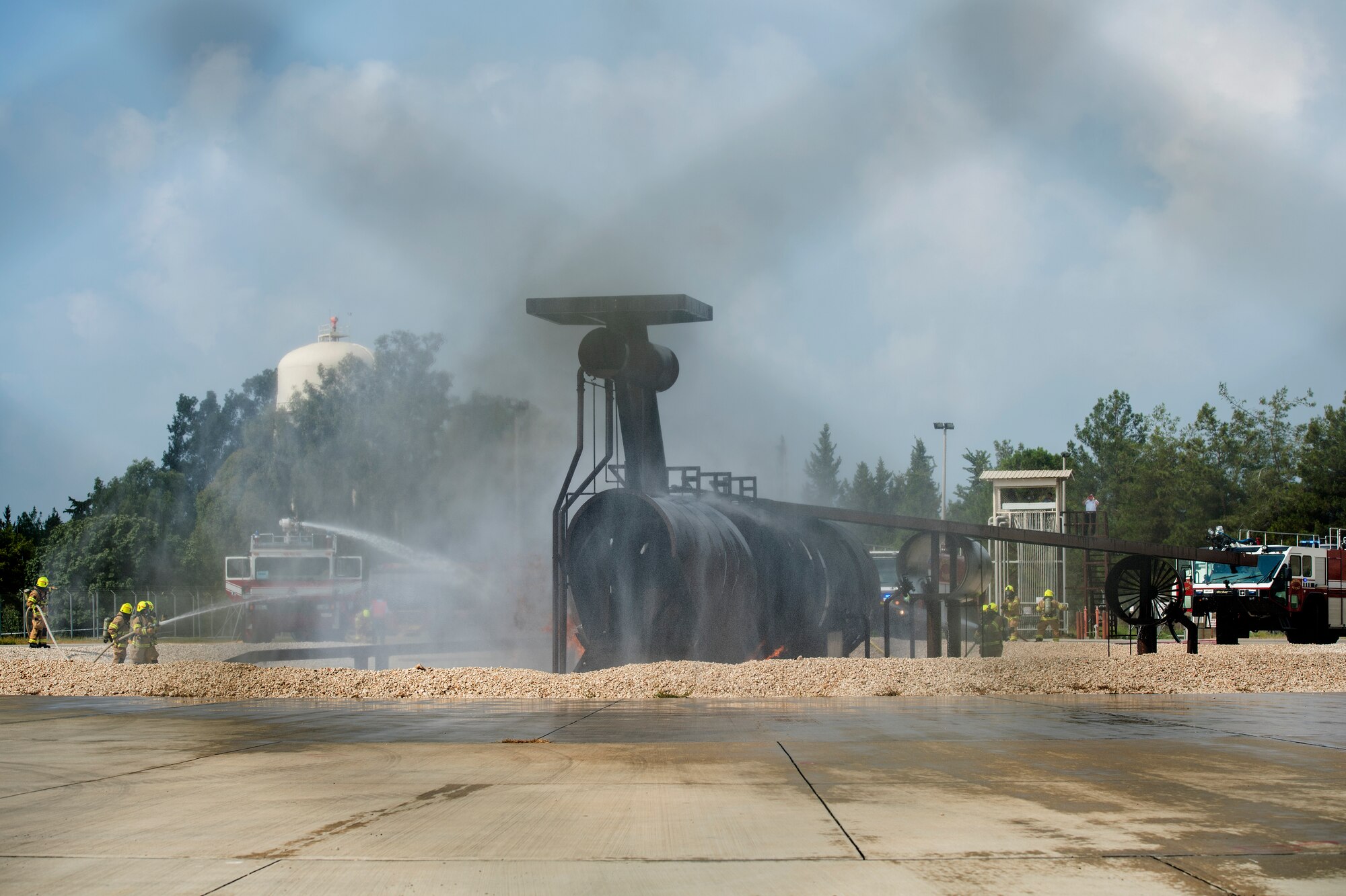 Firefighters finish putting out a simulated aircraft fire at Incirlik Air Base, Turkey, Aug. 7, 2018