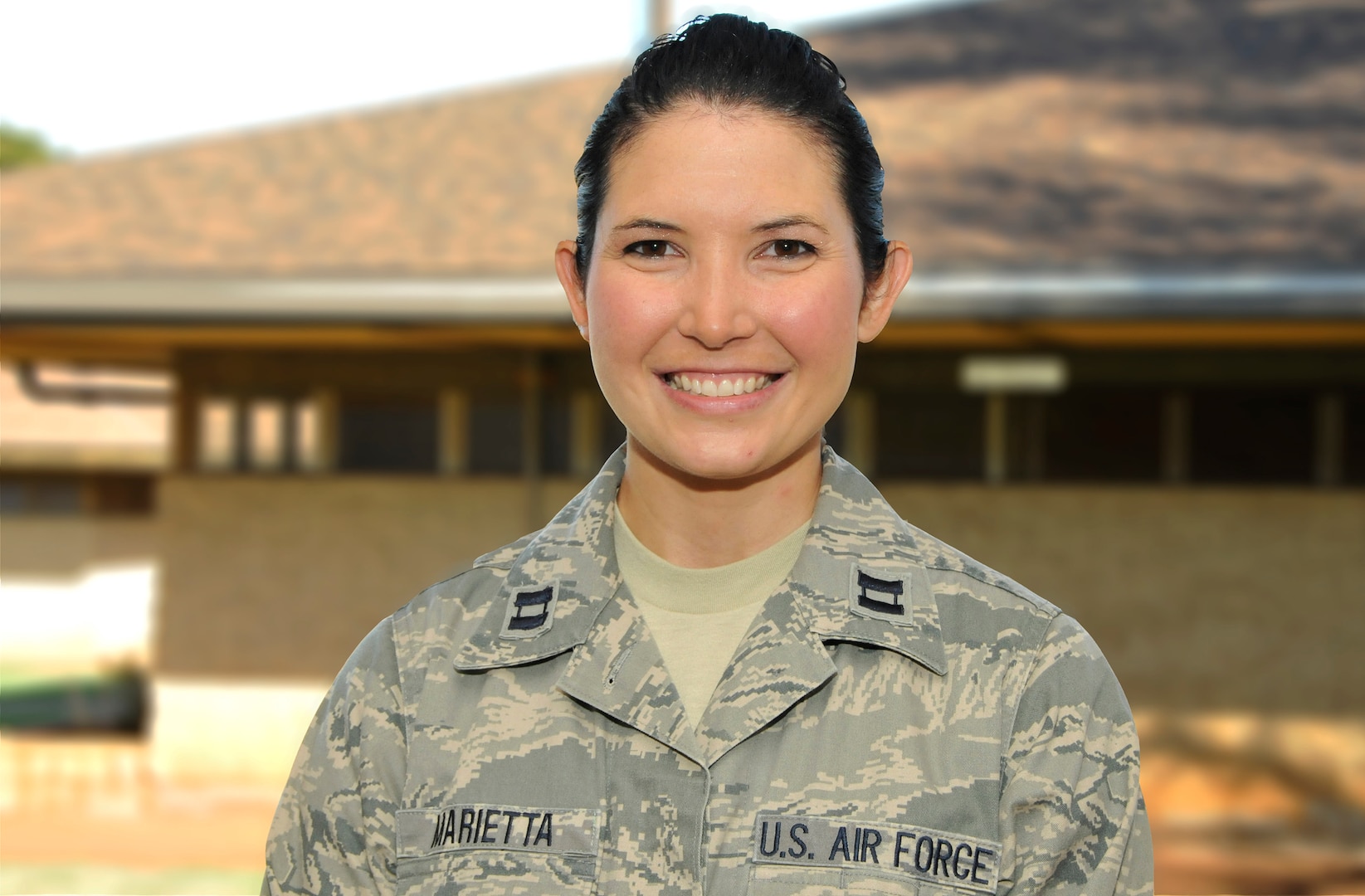 U.S. Air Force Capt. Kelli Marietta, the officer in charge for the Molokai team for Tropic Care Maui County 2018, poses for a portrait photo at the Mitchell Pauole Center, Molokai, Hwaii, Aug. 18, 2018. Tropic Care Maui County 2018 provides medical service members and support personnel “hands-on” readiness training to prepare for future deployments while providing direct and lasting benefits to the people of Maui, Molokai, and Lanai, August 11-19. She assisted at a serious car wreck until EMS personnel arrived.