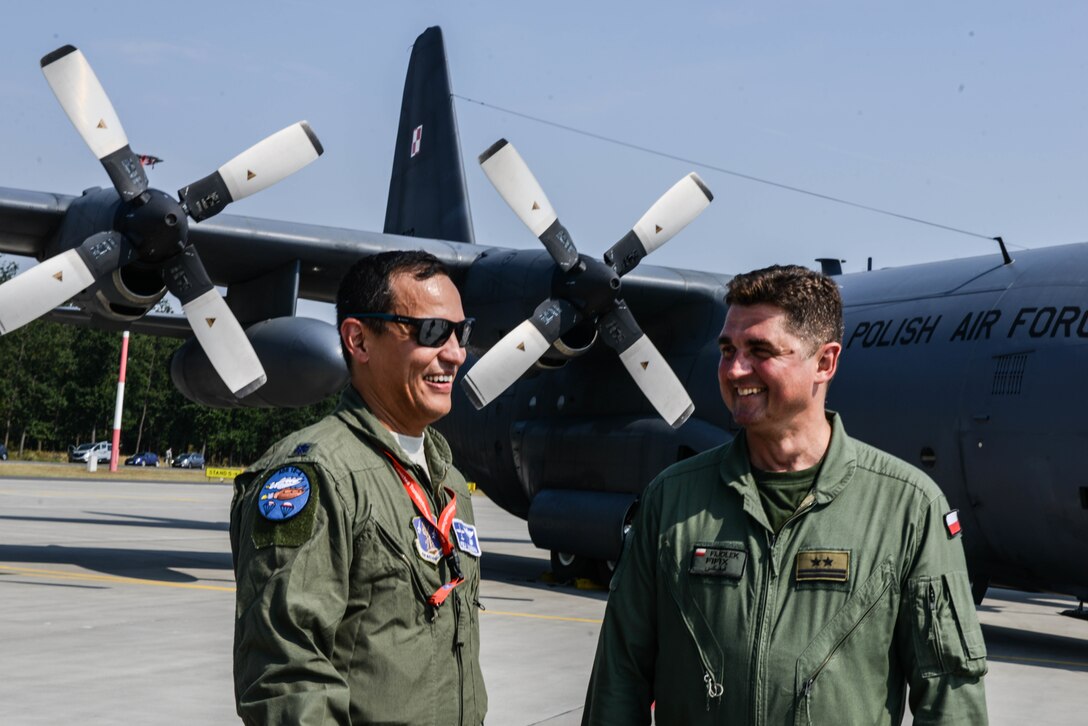 U.S. Air Force Lt. Col. Peter LaBarbera, 52nd Operations Group Detachment 1 assistant director of operations, enjoys a conversation with a Polish Air Force officer on Powidz Air Base, Poland, Aug. 9, 2018. The 52nd OG is based out of Spangdahlem Air Base, Poland, but maintains a permanent presence in Poland through Detachment 1. (U.S. Air Force photo by Senior Airman Joshua Magbanua)