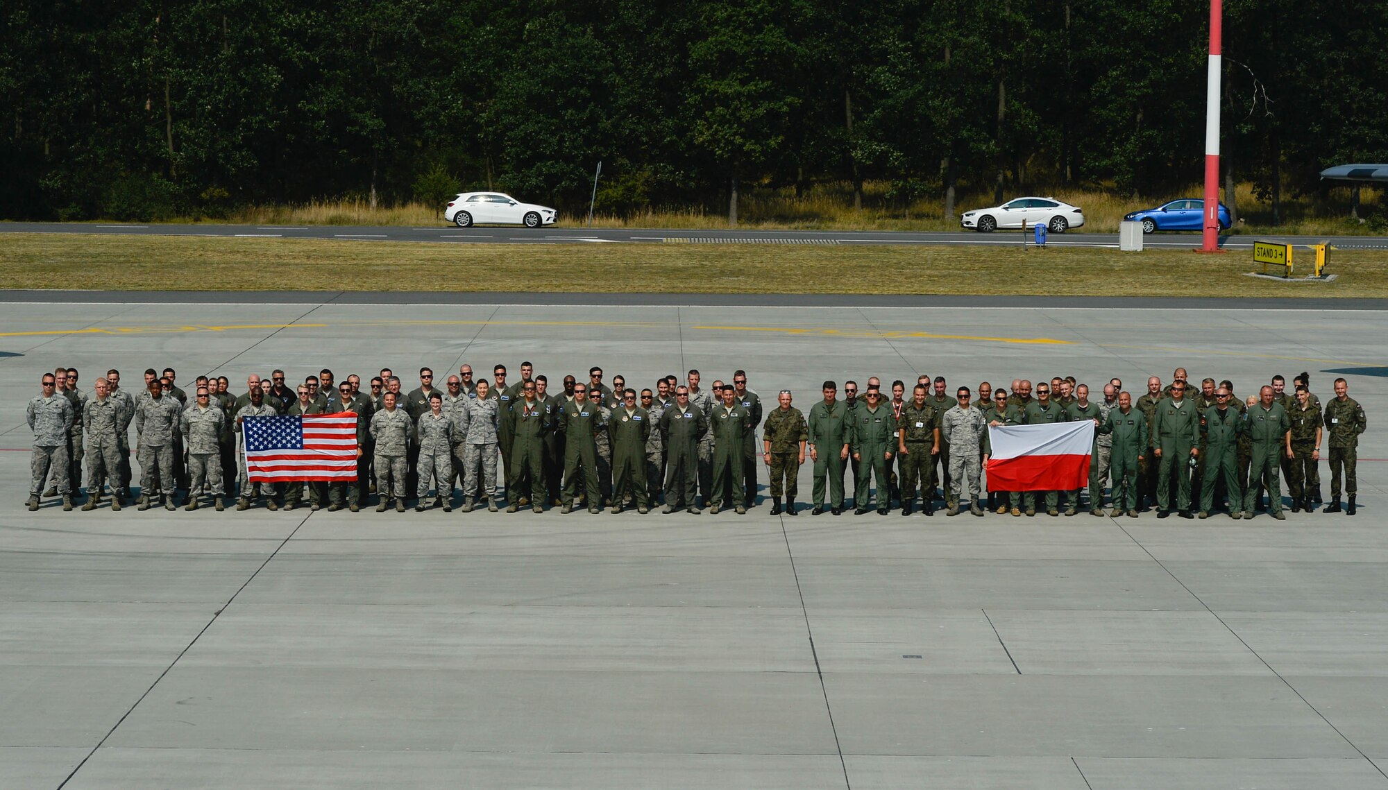 U.S. and Polish air force members pose for a group photo on Powidz Air Base, Poland, Aug. 9, 2018 (U.S. Air Force photo by Senior Airman Joshua Magbanua)