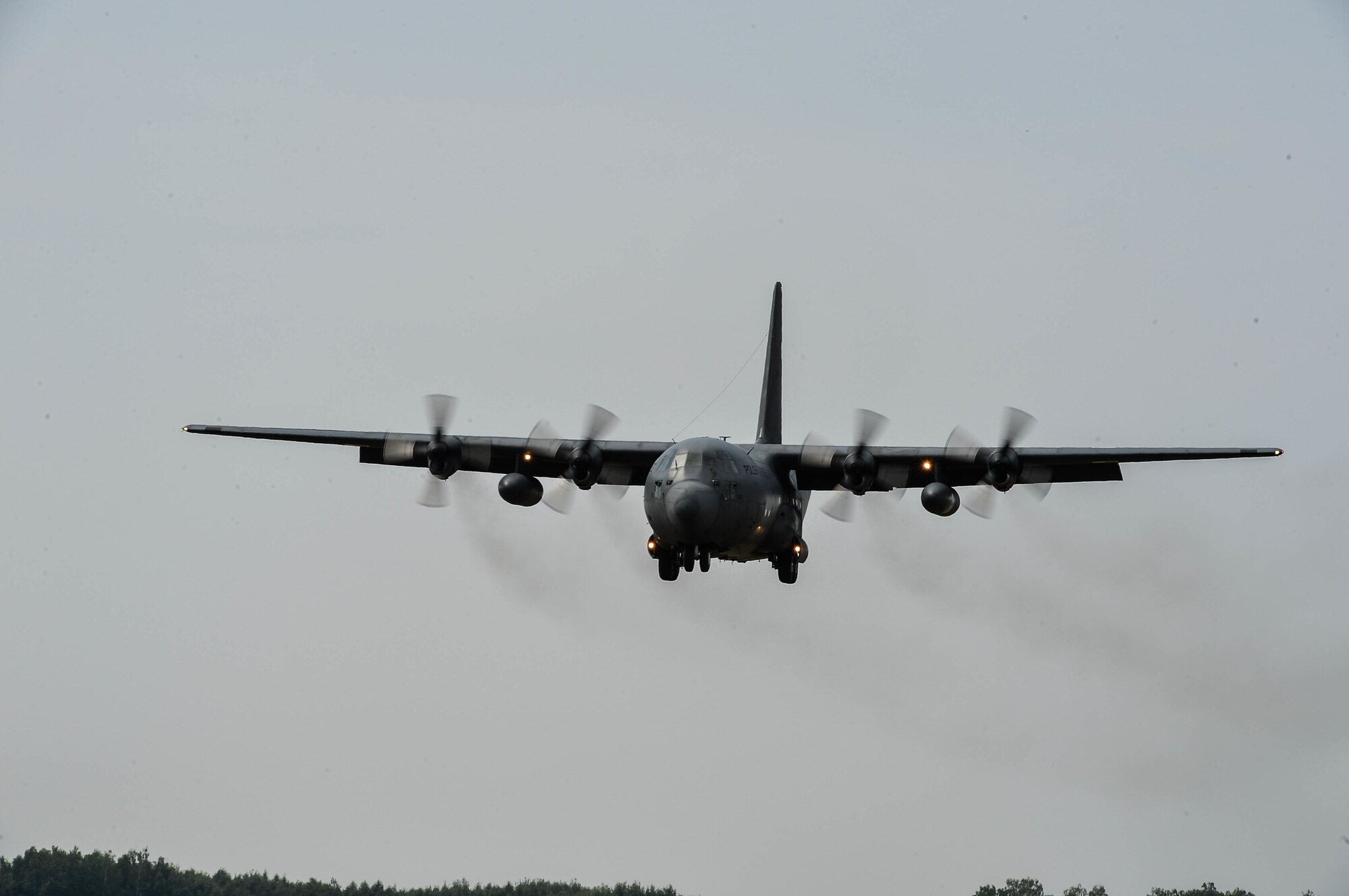 A Polish Air Force C-130E approaches for landing at Powidz Air Base, Poland, Aug. 9, 2018. Polish and U.S. Airmen conducted bilateral exercises to bolster interoperability, improve transnational partnership, and exchange warfighting knowledge. (U.S. Air Force photo by Senior Airman Joshua Magbanua)