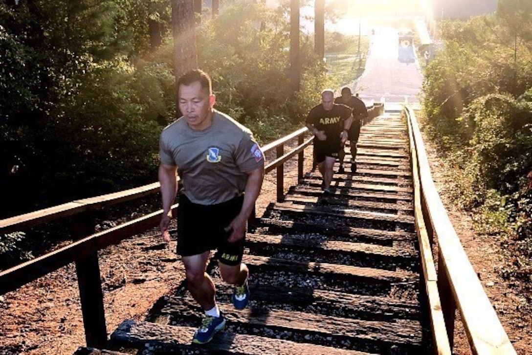 Army Command Sgt. Maj. Thinh Huynh runs stairs during physical training at Fort Bragg, N.C., Aug. 1, 2018. Army photo by Spc. Alleea Oliver
