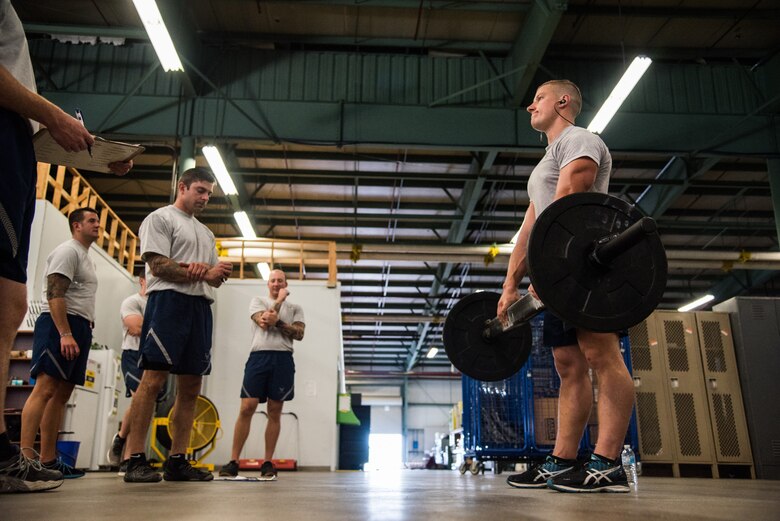 Airman 1st Class Jevon Weixler, an 87th Civil Engineer Squadron Explosive Ordnance Disposal apprentice at Joint Base McGuire-Dix-Lakehurst, N.J., performs the Grip Endurance component of the EOD Tier 2 Physical Fitness Test Prototype at Dover Air Force Base, Del., Aug. 8, 2018. The Air Force Exercise Science Unit administered the EOD Tier 2 test prototype to EOD leaders and technicians during a two-day training event.  (U.S. Air Force photo by Staff Sgt. Damien Taylor)