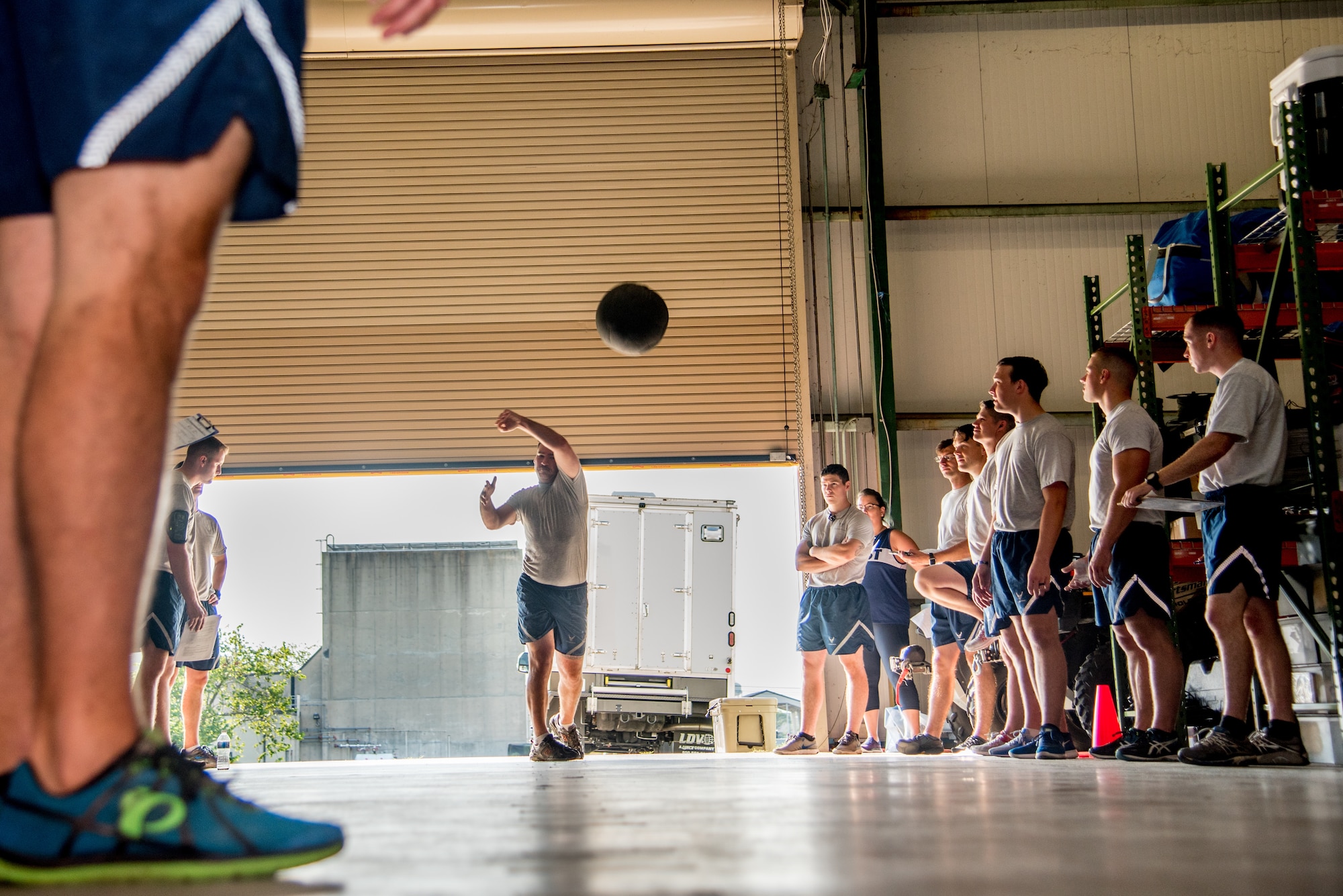 Explosive Ordnance Disposal Airmen perform the Medicine Ball Toss component of the EOD Tier 2 Physical Fitness Test Prototype at Dover Air Force Base, Del., Aug. 8, 2018. EOD Airmen assigned to units in nine states participated in the EOD prototype test. (U.S. Air Force photo by Staff Sgt. Damien Taylor)