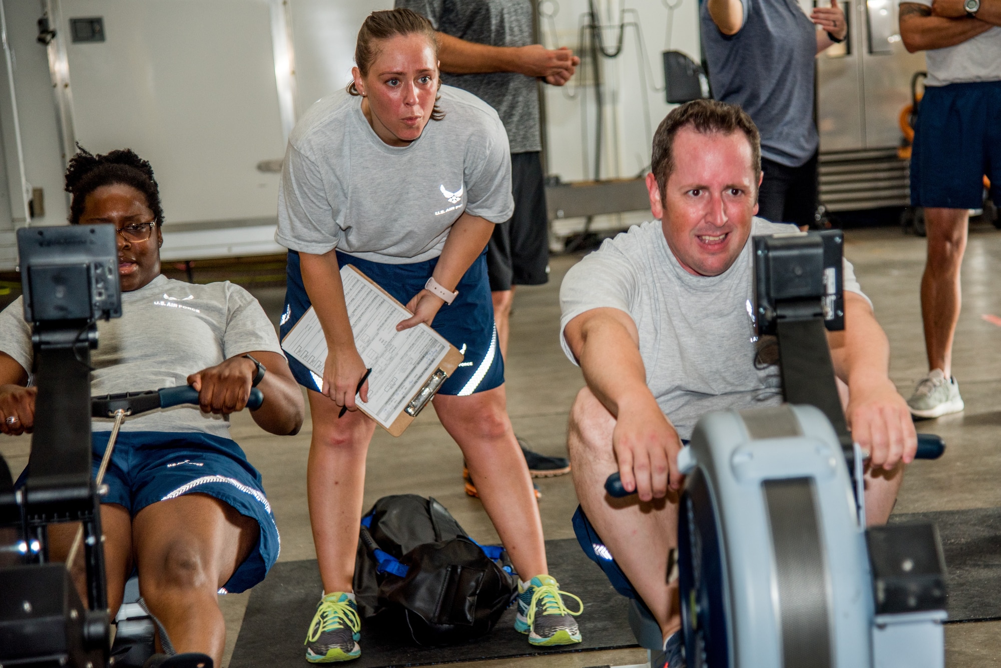 Explosive Ordnance Disposal Airmen perform the Row Ergometer 1,000 meter component of the EOD Tier 2 Physical Fitness Test Prototype at Dover Air Force Base, Del., Aug. 8, 2018. The Row Ergometer 1,000 meter measures the muscular endurance, anaerobic capacity and cardiorespiratory endurance of EOD technicians. (U.S. Air Force photo by Staff Sgt. Damien Taylor)