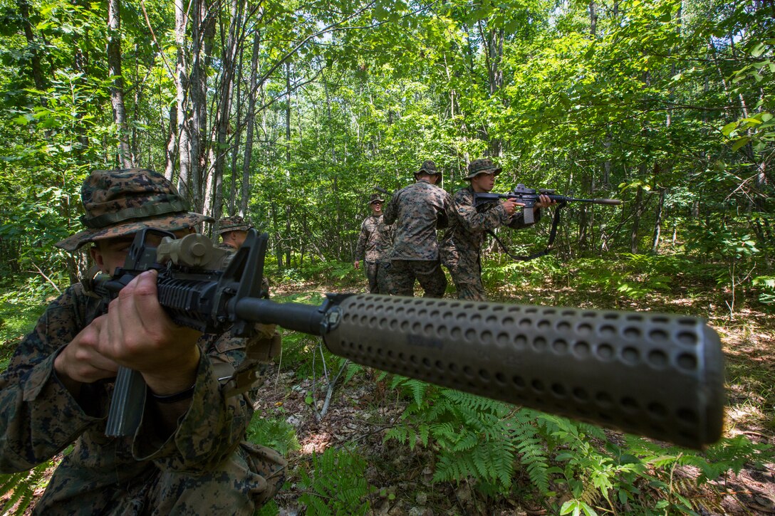 Sgt. David Bloxton, a scout sniper with 3rd Battalion, 25th Marine Regiment, posts security while his team practices crossing a danger zone during Exercise Northern Strike at Camp Grayling, Mich., Aug. 11, 2018. Exercise Northern Strike is a National Guard Bureau-sponsored training exercise that unites service members from multiple branches, states and coalition countries to conduct combined ground and air combat operations. (U.S. Marine Corps photo by Cpl. Niles Lee)