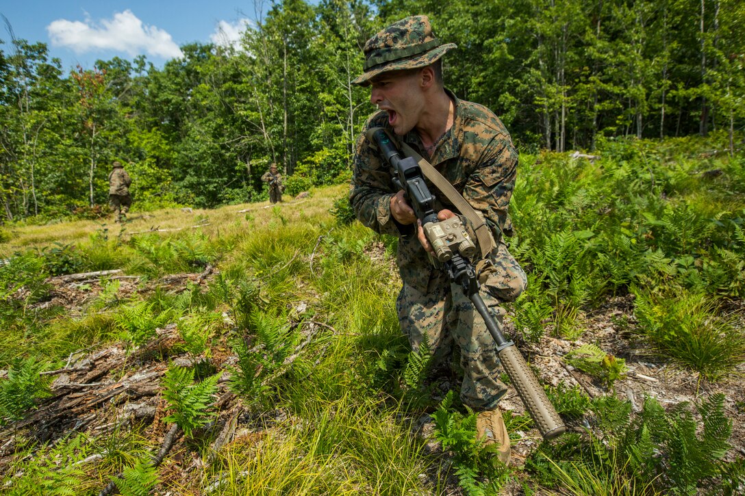Sgt. David Bloxton, a scout sniper with 3rd Battalion, 25th Marine Regiment, communicates with the rest of his team during a break contact drill at Exercise Northern Strike at Camp Grayling, Mich., Aug. 11, 2018. Camp Grayling, the largest National Guard center in the country covering 147,000 acres, offers many large artillery, mortar, tank ranges and maneuver courses. (U.S. Marine Corps photos by Cpl. Niles Lee)