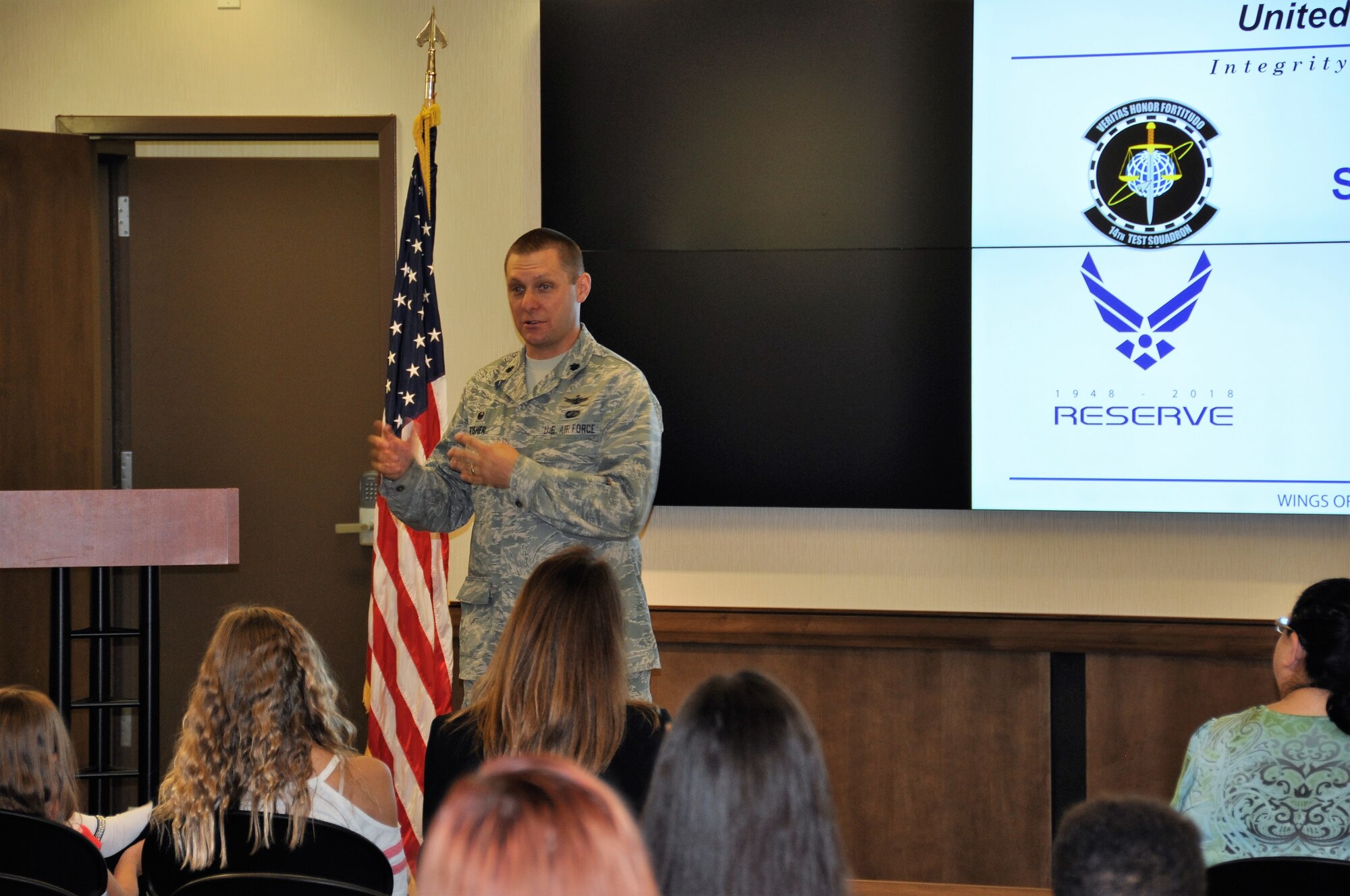 Lt. Col. Adam Fisher explains the mission of the 14th Test Squadron to spouses and significant others prior to their tour inside the Cheyenne Mountain Complex near Colorado Springs, Colo. August 4, 2018.