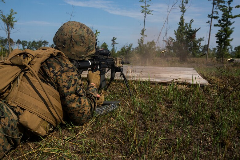 A Marine from India Company, 3rd Battalion, 25th Marine Regiment, fires a M27 Infantry Automatic Rifle at an enemy target during a live-fire range at Camp Grayling, Mich., Aug. 8, 2018. Northern Strike’s mission is to exercise participating units’ full-spectrum of capabilities through realistic, cost-effective joint fires training in an adaptable environment, with an emphasis on joint and coalition force cooperation. (U.S. Marine Corps photo by Cpl. Niles Lee)