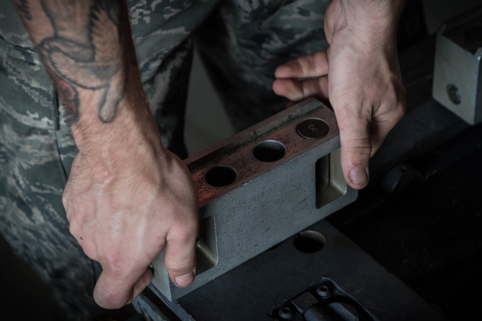 A U.S. Airman assigned to the 77th Aircraft Maintenance Unit applies roller extenders to a bomb loader at Shaw Air Force Base, S.C., Aug. 8, 2018.