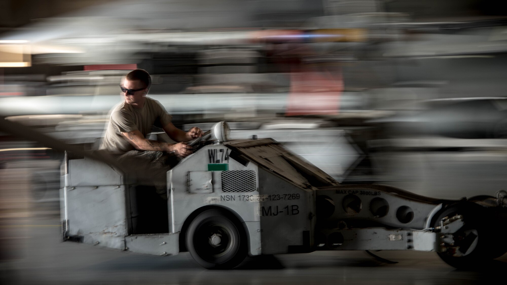 U.S. Air Force Senior Airman James Bridge, 77th Aircraft Maintenance Unit load crew team member, operates a bomb loader at Shaw Air Force Base, S.C., Aug. 9, 2018.