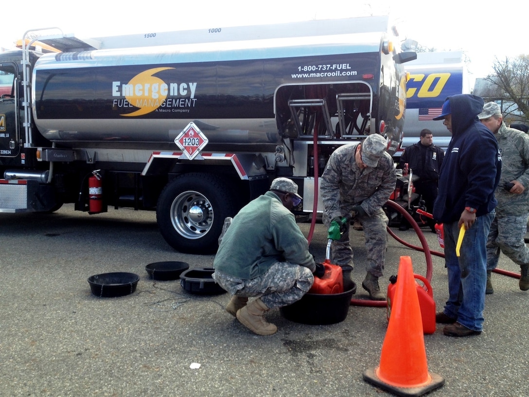 Tanker trucks distribute fuel to residents in New York who were affected by Hurricane Sandy