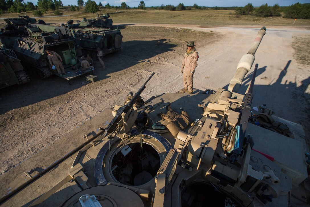 Sgt. Gonzalo Gonzales, a tank leader with Alpha Company, 4th Tank Battalion, inspects a tank after a mechanized attack range at Camp Grayling, Mich., Aug. 9, 2018. Exercise Northern Strike is a National Guard Bureau-sponsored training exercise that unites service members from multiple branches, states and coalition countries to conduct combined ground and air combat operations. (U.S. Marine Corps photo by Cpl. Niles Lee)