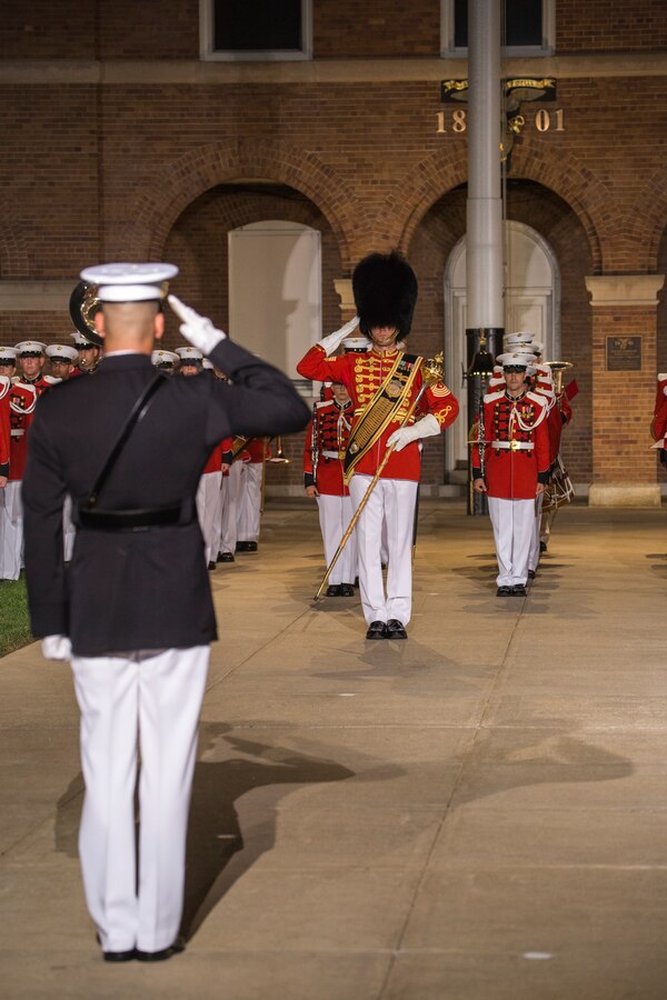 Master Gunnery Sgt. Duane F. King, drum major, “The President’s Own” U.S. Marine Band renders a salute to Scott A. Clippinger, executive officer, Marine Barracks Washington D.C., during a Friday Evening Parade at the Barracks, Aug. 10, 2018. The guest of honor for the parade was the Secretary of the Navy, Richard V. Spencer, and the hosting official was the Commandant of the Marine Corps, Gen. Robert B. Neller. (Official Marine Corps photo by Sgt. Robert Knapp/Released)