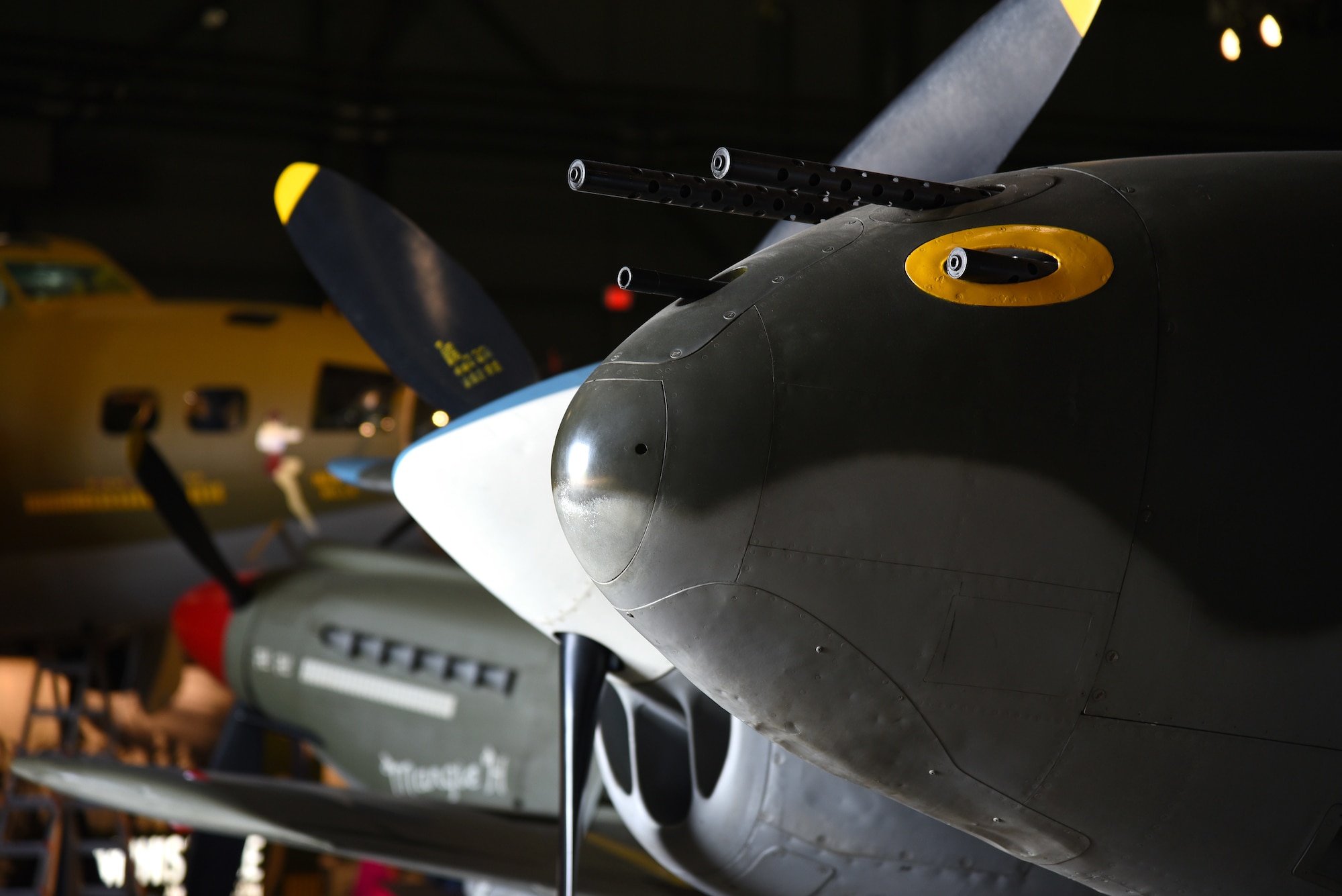 A view of the Lockheed P-38L Lightning in the WWII Gallery at the National Museum of the U.S. Air Force during the move back to the gallery on Aug. 13, 2018. Several WWII era aircraft on display were temporarily placed throughout the museum to provide adequate space for the Memphis Belle exhibit opening events. (U.S. Air Force photo by Ken LaRock)