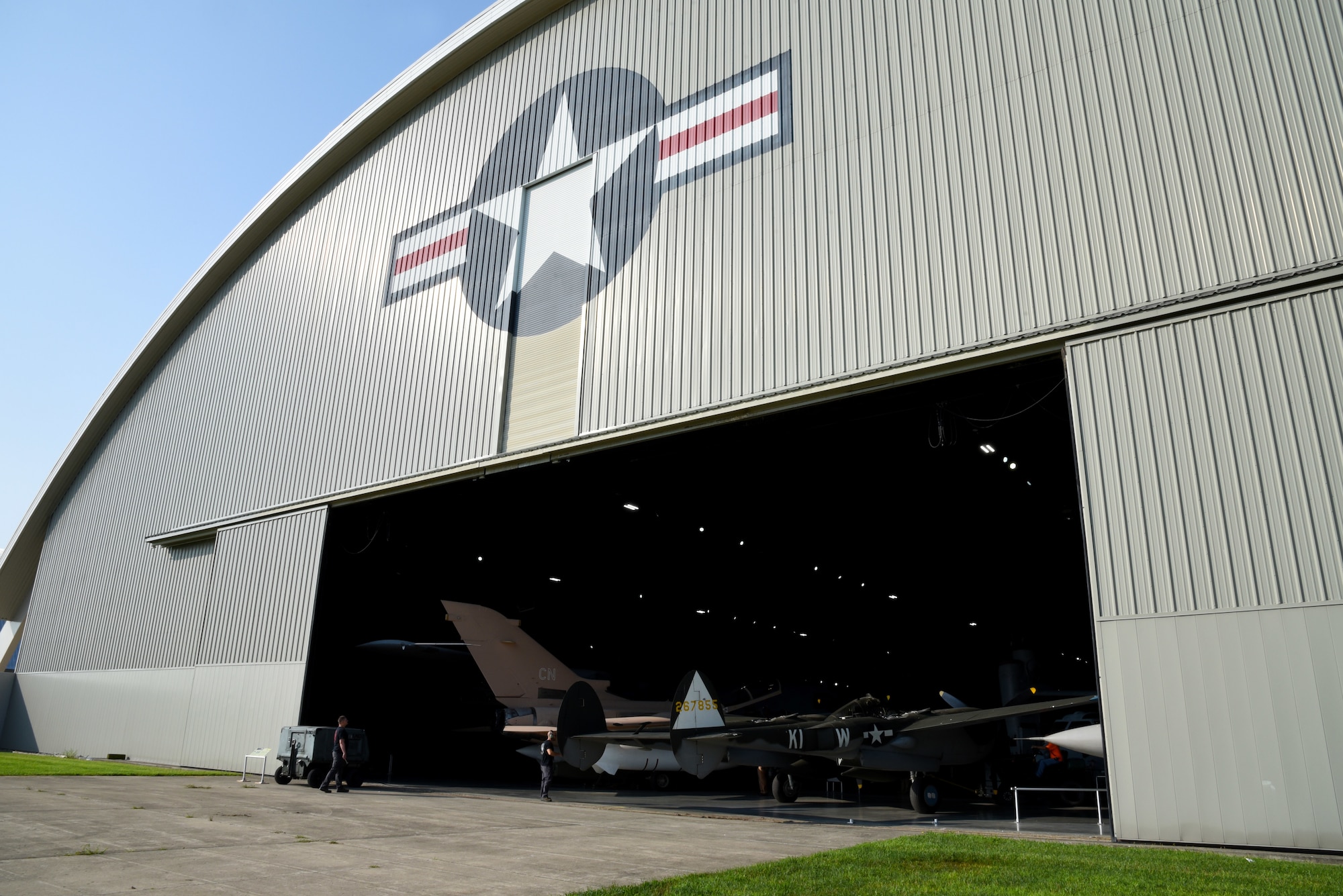 Museum restoration crews prepare to move the Lockheed P-38L Lightning back into the WWII Gallery at the National Museum of the U.S. Air Force. Several WWII era aircraft were temporarily placed throughout the museum to provide adequate space for the Memphis Belle exhibit opening events. (U.S. Air Force photo by Ken LaRock)