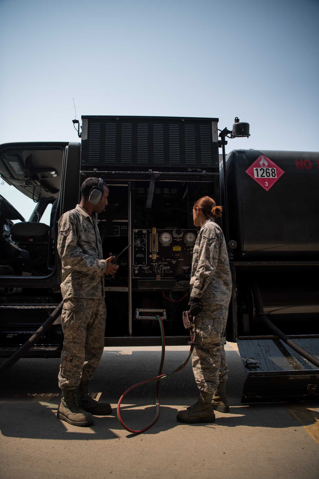 Airman 1st Class Heather Manzanares and Wilson control and monitor the flow of fuel during operations at Beale Air Force Base, California, Aug. 9, 2017