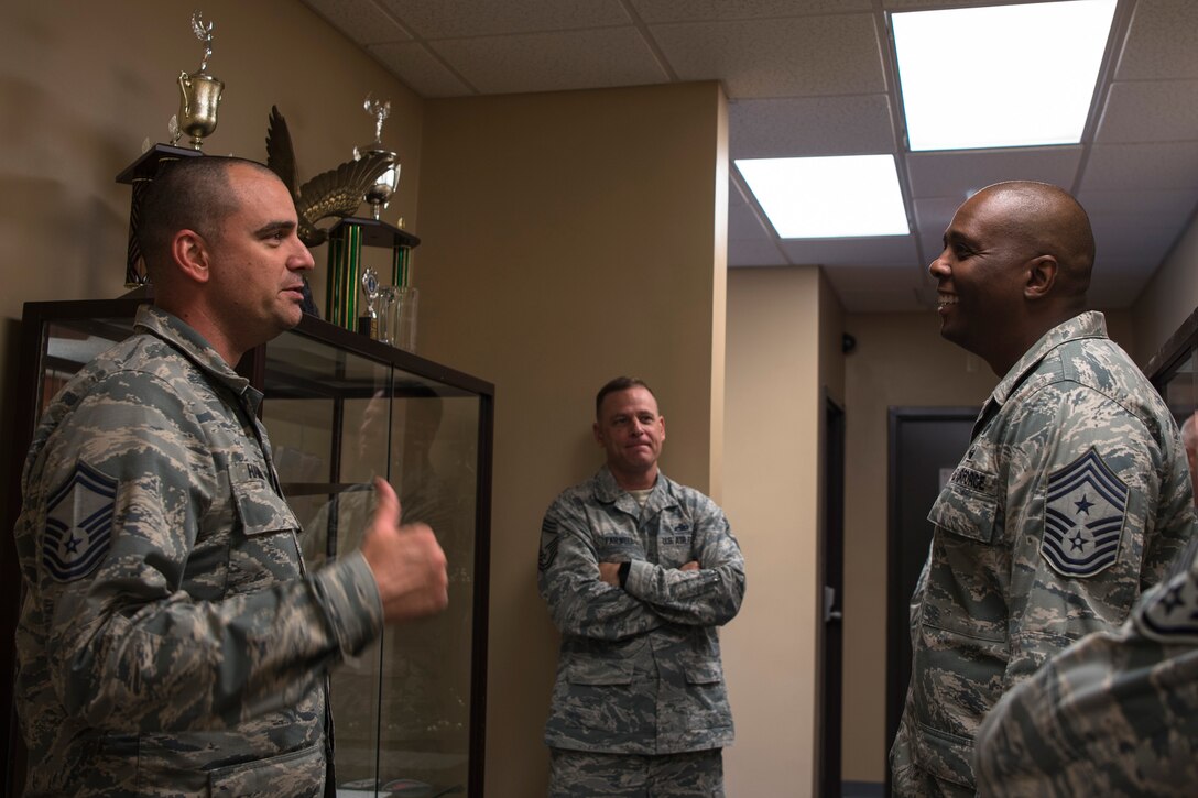Senior Master Sgt. Corey Hammond, left, 23d Maintenance Squadron (MXS) materiel section chief, talks with Chief Master Sgt. James Allen, 23d Wing command chief, during an immersion, Aug. 10, 2018, at Moody Air Force Base, Ga. Allen learned about the Airmen and heard their viewpoints and feedback regarding the operations of the 23d MXS. (U.S. Air Force photo by Airman Taryn Butler)