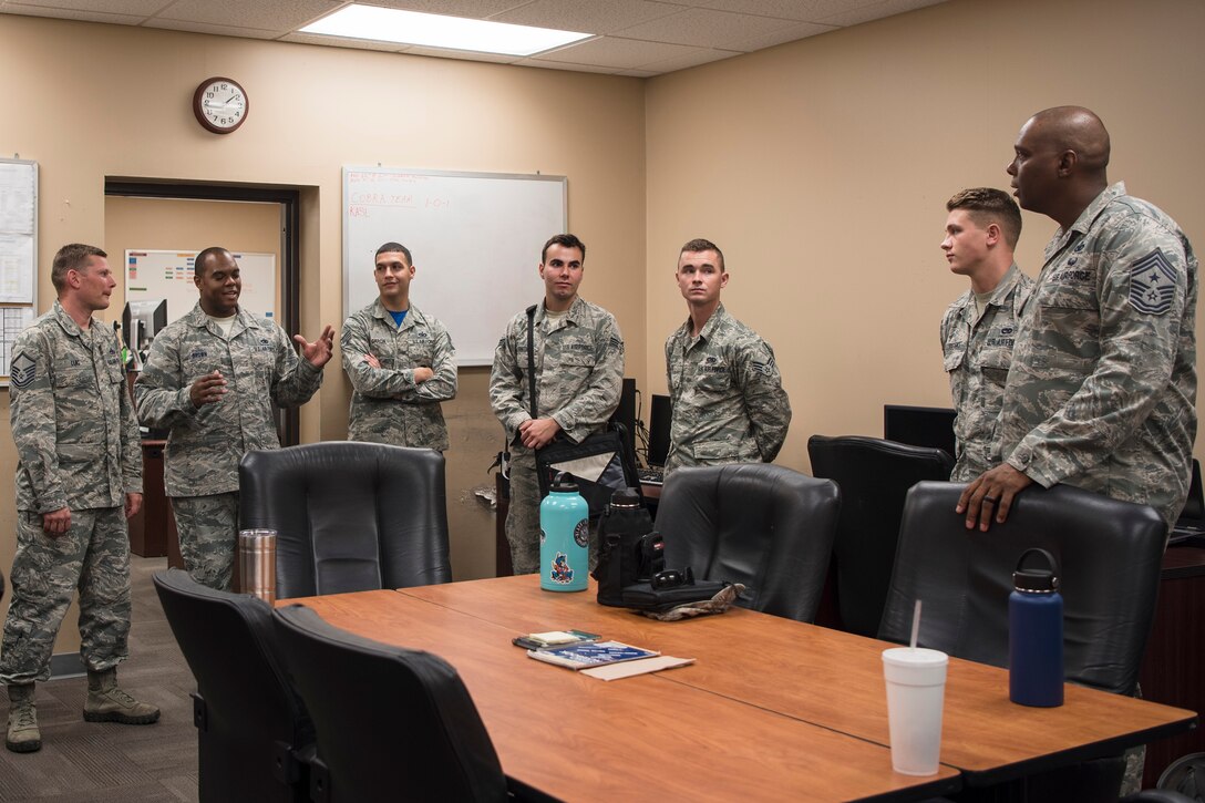 Chief Master Sgt. James Allen, right, 23d Wing command chief, talks with Airmen from the 23d Maintenance Squadron (MXS) during an immersion, Aug. 10, 2018, at Moody Air Force Base, Ga. Allen learned about the Airmen and heard their viewpoints and feedback regarding the operations of the 23d MXS. (U.S. Air Force photo by Airman Taryn Butler)