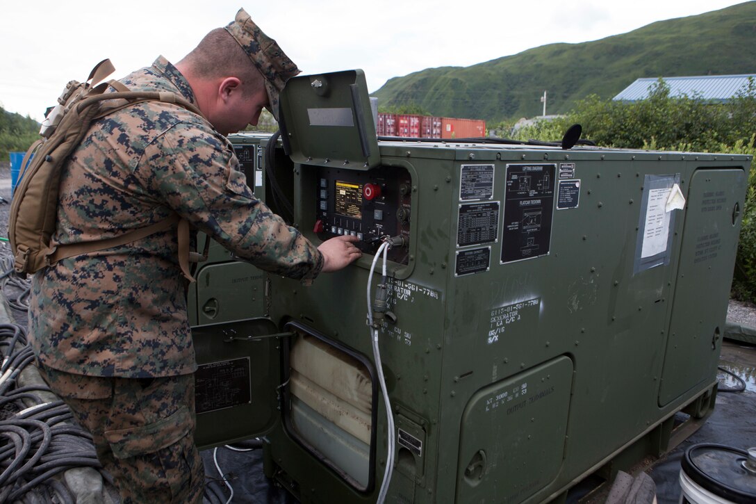 Lance Cpl. Arthur Collins, a generator mechanic with Marine Wing Support Squadron 471, 4th Marine Aircraft Wing provides maintenance to the generators that provide energy to the equipment supporting Innovative Readiness Training Old Harbor, Aug. 6, 2018. The IRT program supports troop’s readiness to fight through training, while serving American communities. (U.S. Marine Corps photo by Lance Cpl. Tessa D. Watts)