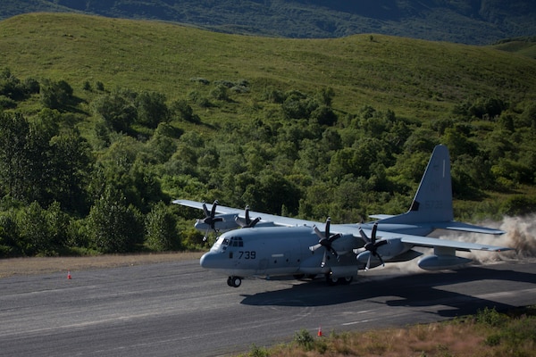 Col. Charles Moses, the commanding officer of Marine Air Group 41, 4th Marine Aircraft Wing lands a C-130 onto the newly extended runway for the first time during Innovative Readiness Training Old Harbor, Alaska, Aug. 7, 2018. This year marks the completion of the 2,000-foot extension of Old Harbor’s runway. (U.S. Marine Corps photo by Lance Cpl. Tessa D. Watts)