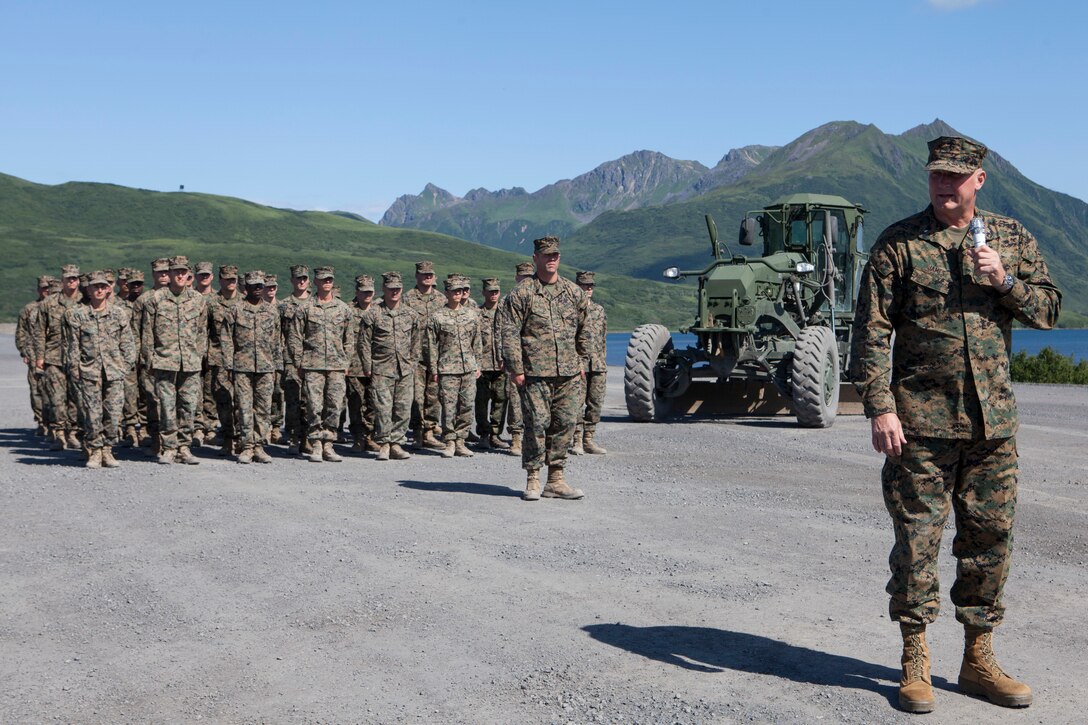 Brig. Gen. Bradley S. James, commanding general of 4th Marine Aircraft Wing speaks to the community and other distinguished guests during the ribbon cutting ceremony Aug. 7, 2018 in front of a platoon of Marines who participated in Innovative Readiness Training Old Harbor. This year marks the completion of the 2,000-foot extension of Old Harbor’s runway. (U.S. Marine Corps photo by Lance Cpl. Tessa D. Watts)