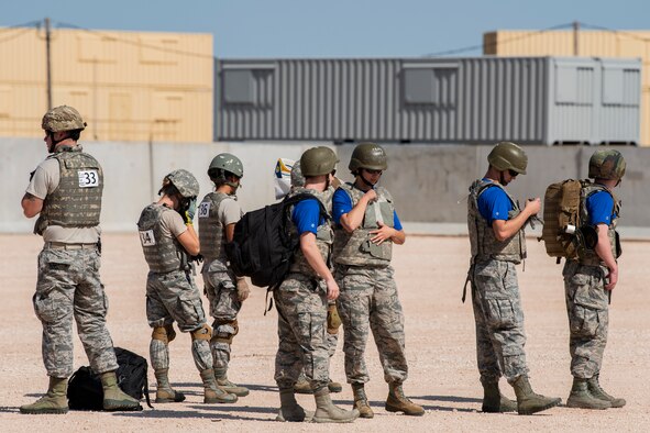 Airmen get geared up for the Emergency Medical Technician Rodeo at Melrose Air Force Range, N.M., Aug. 8, 2018. A total of 21 Air Force bases from around the world visited MAFR and Cannon Air Force Base, N.M., to participate in the EMT Rodeo, giving the technicians a wide assortment of scenarios to test their knowledge and training in the medical field. (U.S. Air Force photo by Airman 1st Class Gage Adison Daniel)
