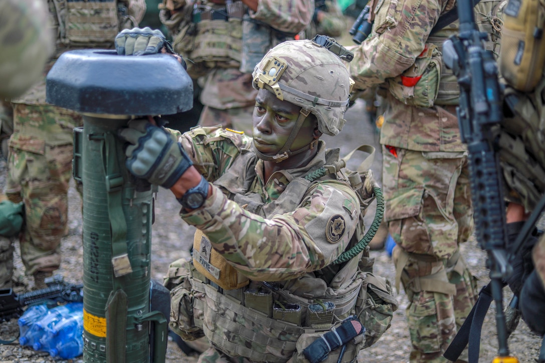 A soldier tests some military equipment.