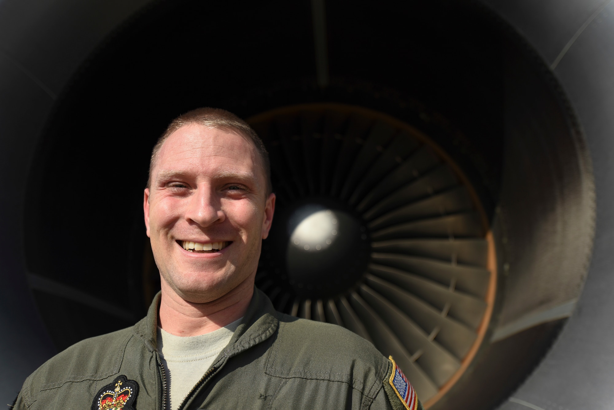 U.S. Air Force Master Sgt. Jonathan Haas, Royal Australian Air Force 33rd Squadron KC-30A Multi-Role Tanker Transport air-refueling operator, smiles in front of a KC-30A Multi-Role Tanker Transport turbine on RAAF Base Darwin, Australia, Aug. 8, 2018. Haas is assigned to RAAF Base Amberley, Australia, and has been an air-refueling instructor with the USAF Military Personnel Exchange Program for two years. (U.S. Air Force photo by Senior Airman Savannah L. Waters)