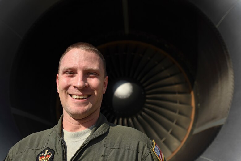 U.S. Air Force Master Sgt. Jonathan Haas, Royal Australian Air Force 33rd Squadron KC-30A Multi-Role Tanker Transport air-refueling operator, smiles in front of a KC-30A Multi-Role Tanker Transport turbine on RAAF Base Darwin, Australia, Aug. 8, 2018. Haas is assigned to RAAF Base Amberley, Australia, and has been an air-refueling instructor with the USAF Military Personnel Exchange Program for two years. (U.S. Air Force photo by Senior Airman Savannah L. Waters)