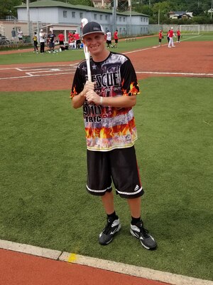 Staff Sergeant Kyle R. Ashley, southern resident office quality control representative, poses for a photo before a post softball game at Camp Henry