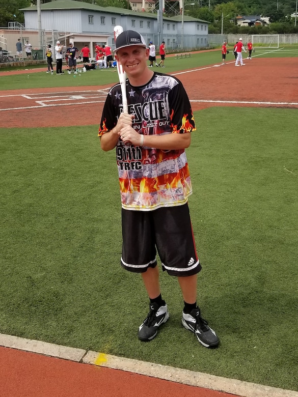 Staff Sergeant Kyle R. Ashley, southern resident office quality control representative, poses for a photo before a post softball game at Camp Henry
